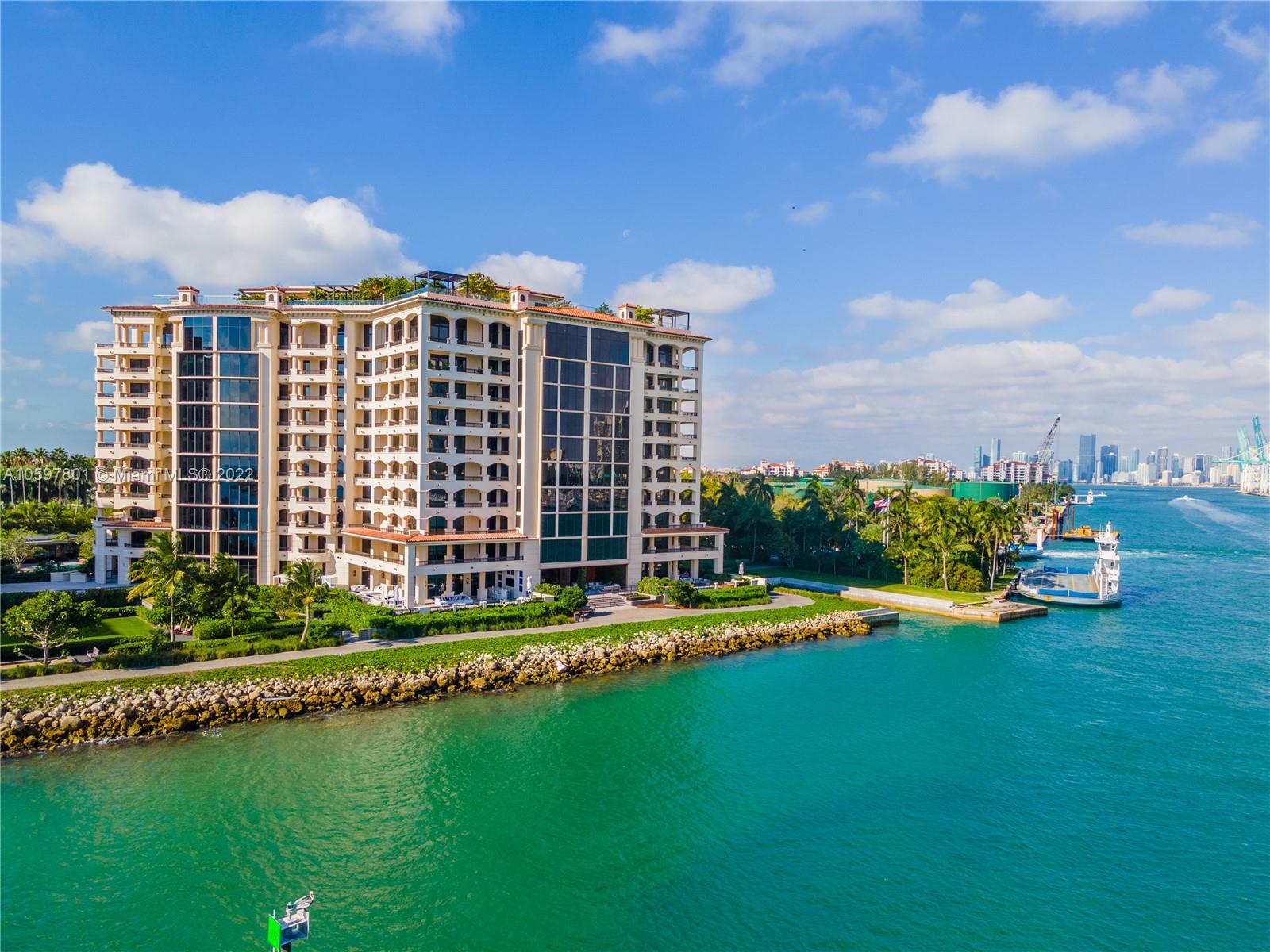 WALK RIGHT INTO BREATHTAKING OCEAN VISTAS IN ONE OF THE BEST FLOORPLANS EVER DESIGNED ON FISHER ISLAND DESIGNED BY CHAHAN MINASSIAN! Located in One of the Most Desireable Buildings that This Spacious 4 Bedroom + 5.5 Baths Split Floorplan in 6,170 SF of Living Space. The Residence Boasts Unobstructed Views of the Island’s Mile-long Beach, Biscayne Bay & Golf Course. Dine & Entertain in Generous Exterior Terraces that Wrap Residence with Double Exposures & a Hot Tub Overlooking the Beach for Ideal Indoor/Outdoor Lifestyle. Cabochon Limestone Floors & Detailed Moldings in Soft Cream Tones. Double Facing Fireplace in Grand Living Area, Wet Bar, Huge Eat-in Kitchen & Dining Area/Family Room. Timeless Living Comfort Perfect for Families. Parking for 2 Cars & 1 Golf Cart + 1 Storage Space.