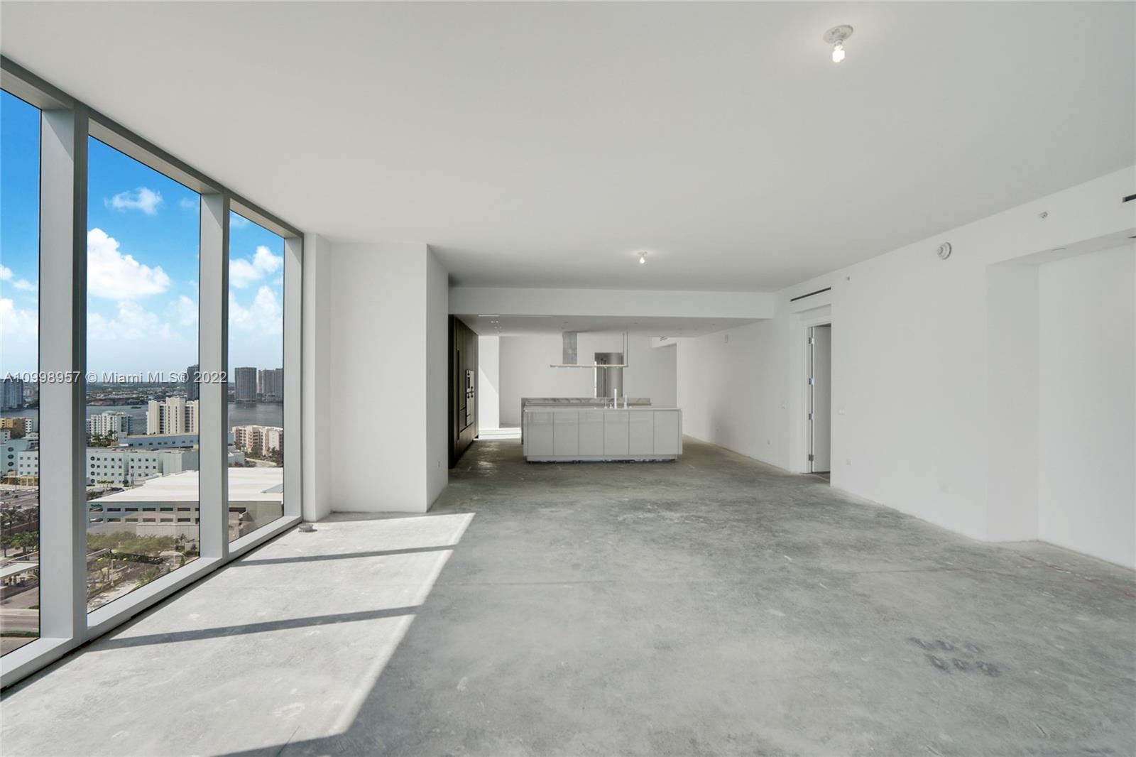 Picture from the Balcony looking West and Kitchen, the door in the right goes to the Master Bedroom and at the end the door entrance to the others bedrooms