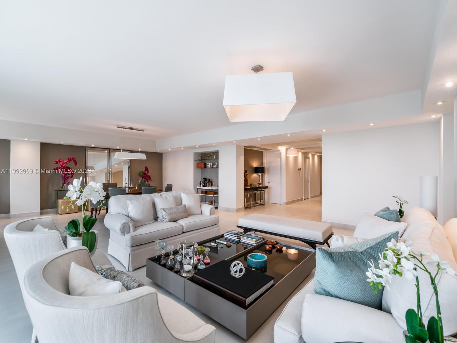Masterful and modern luxury are uniquely embodied in this 4 bedroom and  4.5 bath Penthouse with 3,820 Square Feet plus 410 Square Feet of full size balconies boasting  stupendous views of the beach, the Sunrise and the Sunset. This one a kind home was redone luxurious finishes. Ocean views, bright accents and light pours into every room! Every detail was carefully selected. Highlights include light, sound and shade systems, marble bathrooms, marble flooring, artwork display lighting, and top designer wallpapers throughout. This property also includes  a separate Staff/ In laws Suite located in the building's first floor plus 2 assigned garage spaces and a Storage unit.