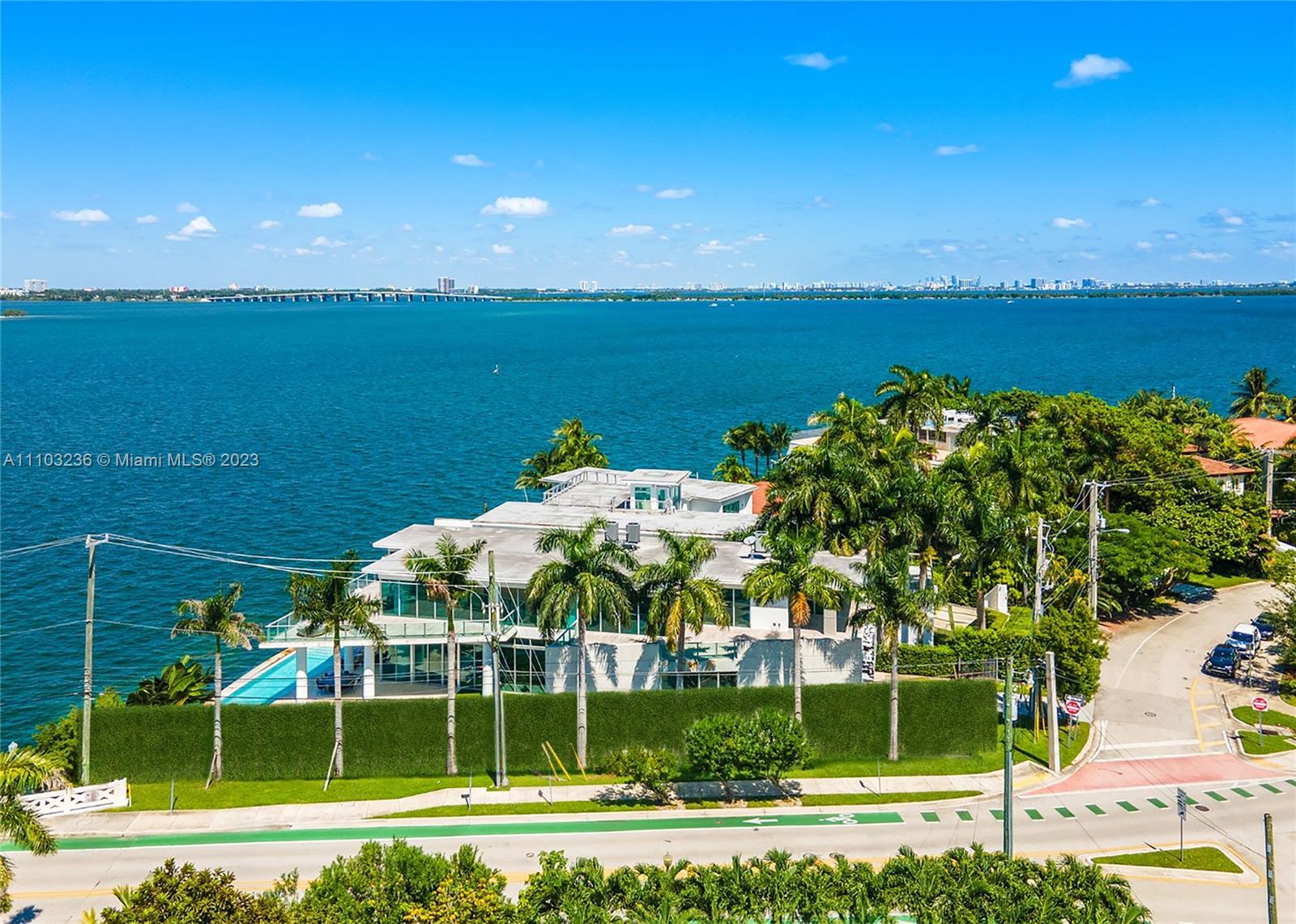 Tropical Modern 8,871 SF estate on the wonderful Venetian Islands will certainly impress upon arrival.  The sun drenched mansion boasts triple exposures from the tip of San Marco Island. Striking Downtown Miami Skyline views and sunsets to the west, cruise ships alley to the south and Edgewater skyline to the north.  An impressive spiral staircase, reminiscent of the Guggenheim Museum, graces the home as a sculptural work of art.  Beautiful Scandinavian interior design features wide plank wood floors, Baltic Grey Marble and Carrara Marble diamond patterns adorn the wonderful social rooms, and an enormous open concept kitchen all with water views.The grand suite features a flow-through fireplace, gym, full spa with  steam/sauna, waterfall jacuzzi and meditation room. Live the ultimate life.
