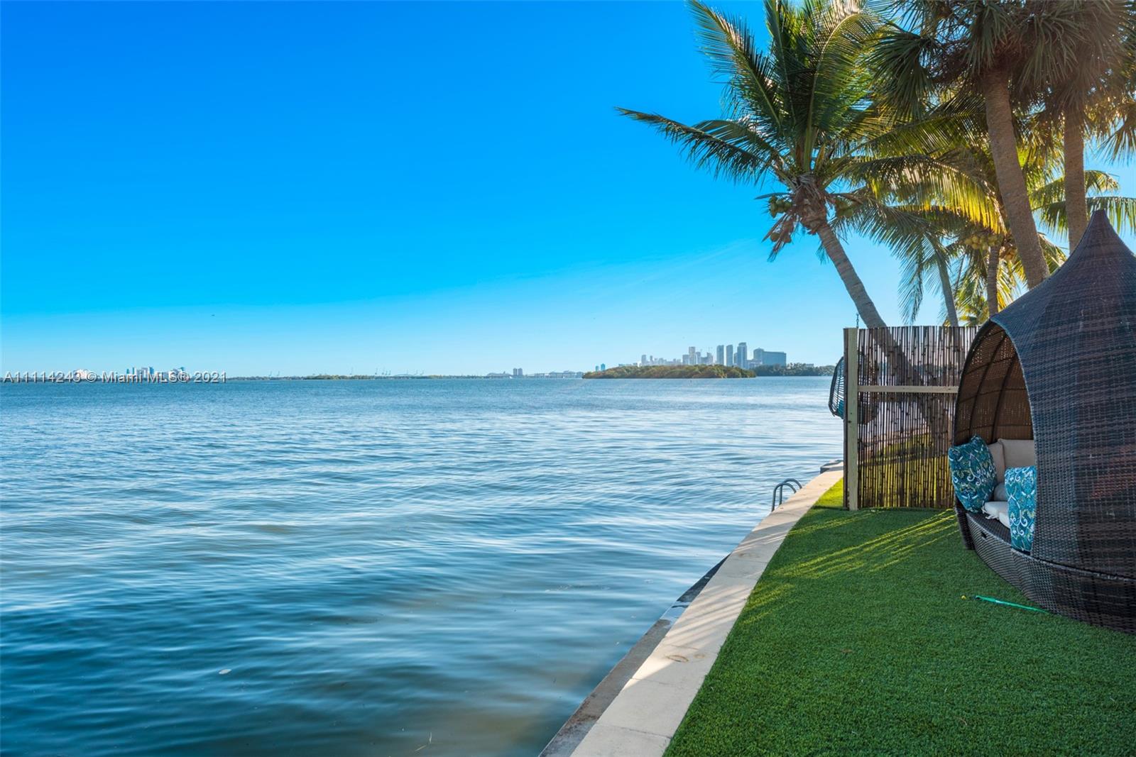 162 Feet of frontage on Miami's open bay. This home has an amazing wide view,  you can sit quietly and  see the bay's natural habitat with birds and dolphins. The home features an open floor plan from the kitchen to the living room with windows running around the back for viewing the waterfront. This is also and an opportunity to build your dream home with one of Miami's best views in the gated community of Belle Meade Island. Home to many new single family new construction, this is a great location very close to Miami's Design District for shopping and restaurants.