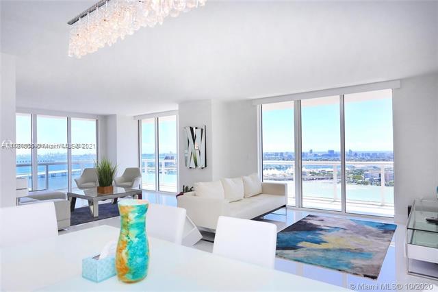 Fully Furnished. Stunning views of Biscayne Bay welcome you to this stunning 3BR/2BA modern condo located across from Bayfront Park & steps from fine restaurants, AA arena, Bayside, PAMM & Performing Centers. This corner unit boasts 1,749 SF of living space and is impeccably decorated with exquisite glass floors throughout. Open kitchen with top-of-the-line stainless steel appliances, master suite with his/her walk-in closets & bathroom with sep. tub & shower. Wrap-around balcony, motorized shades & more. No Pets!