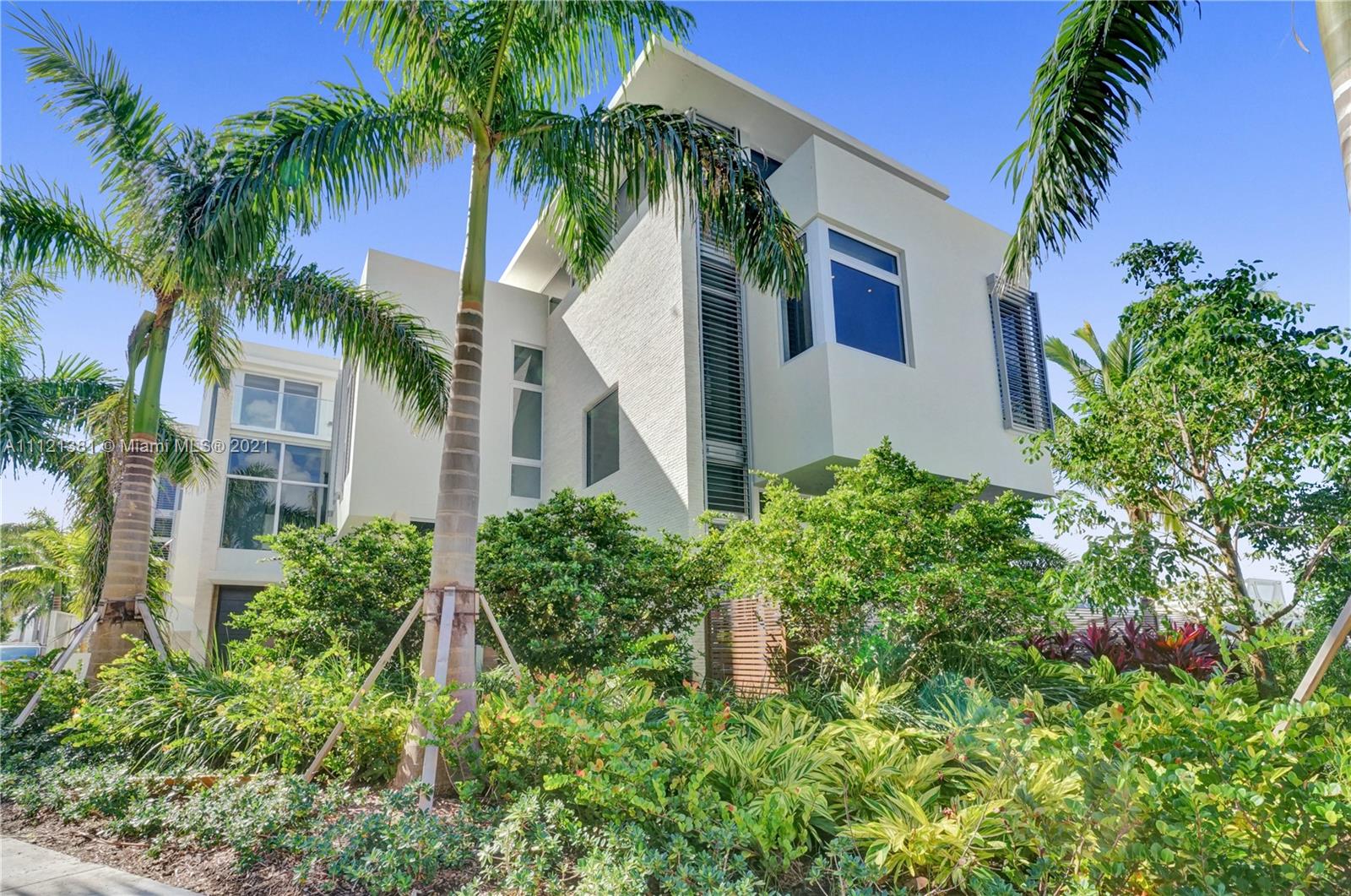 PUBLIC OPEN HOUSE SUNDAY 12/19 from 12-3PM!Never lived-in luxurious 3-story waterfront corner townhome, natural light shining thru 12ft floor-to-ceiling, impact windows. Enter thru the foyer into the open kitchen overlooking the living room & spacious terrace w/ marina views. Kitchen by MiaCucina w/ Wolf appliances, quartz countertops, subzero integrated refrigerator, & wine cooler on the oversized island. Private elevator. This large home, great for entertaining, has 4 BR + staff quarters & 5.5 BA. Rooftop terrace. Enjoy 1,473 Sq. Ft. of outdoor space with serene water views. Have the option to purchase a 90 ft. boat slip in front of your terrace for $250,000. Private two-car garage. Delight in the luxurious amenities at The Point: 3 pools, 4 tennis courts, 25,000 SqFt. Club & Spa