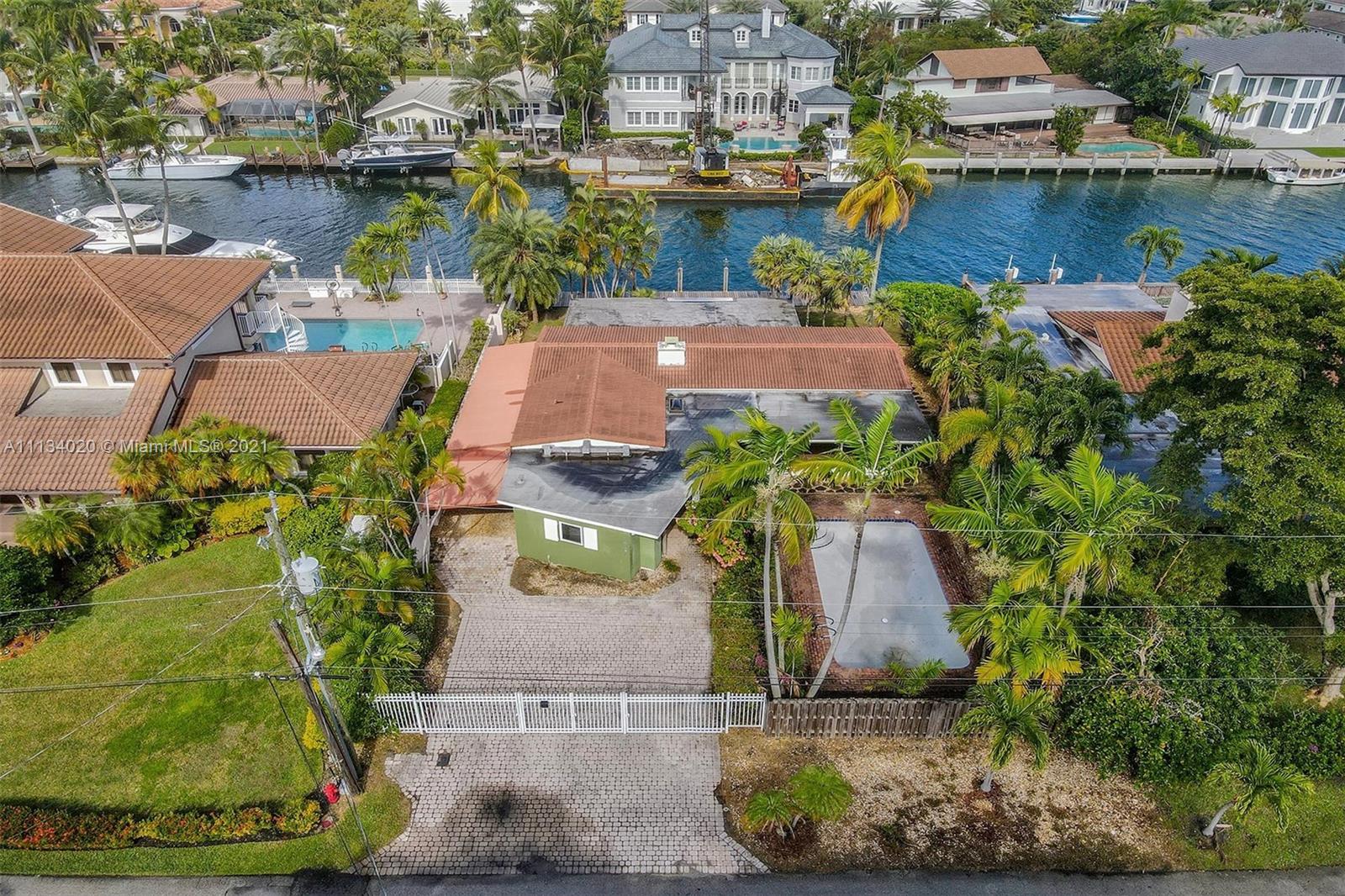 IT'S ALL ABOUT LOCATION!!! This property is located in the very desirable Rio Vista neighborhood, has amazing views, wide canal with direct ocean access, 75 ft dock. You can renovate this property or build your dream home...Centrally located, close to shops, restaurants, international airport, etc.
