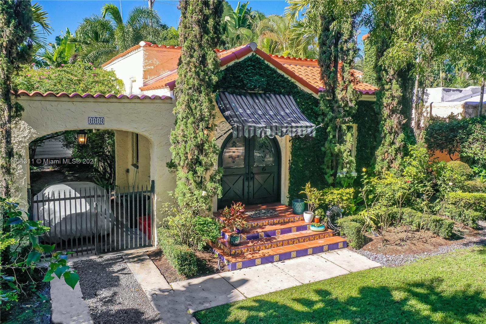 Stunning Old Spanish gem in desirable quiet neighborhood minutes from downtown Coral Gables.  Charming 2/1 in main house with open floor plan, working fireplace, hardwood floors, beautiful tiles and renovated kitchen/gas stove plus 1/1 detached guest house cottage. All new impact windows, new roof (2020), new pipes, new ducts/insulation, updated electric, new tankless water heater. Large master bedroom with oversized closet and high ceilings. Cozy garden with old Chicago brick pavers perfect for outdoor entertaining. Washer/Dryer area off from kitchen. Completely move-in ready!