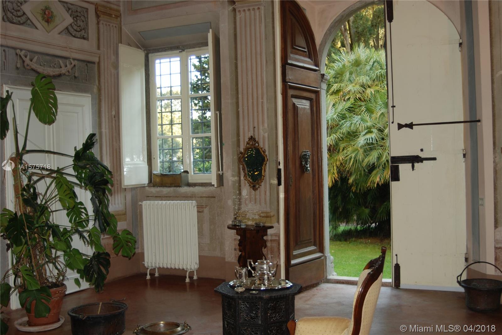 Living room entry ... Hand carved wooden doors.