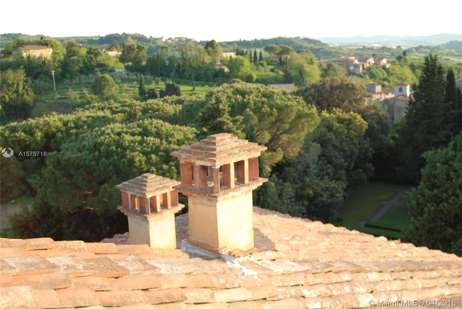 A view of the rooftop and chimneys ...  cypress and pines ...  Tuscany  