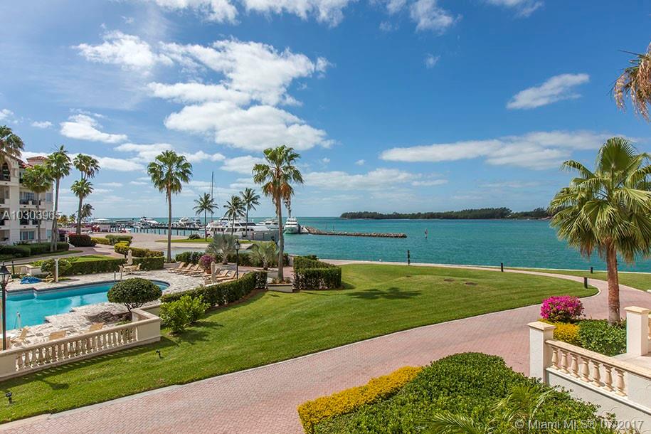 THIS STUNNING BRIGHT AND SUNNY BAYSIDE VILLAGE 2ND FLOOR CONDO OVERLOOKING THE FISHER ISLAND MARINA, ATLANTIC OCEAN AND POOL. FEATURES INCLUDE: 2 BEDROOMS + DEN, 2.5 BATHS, MARBLE AND WOOD FLOORS THROUGHOUT, RENOVATED KITCHEN WITH WOOD CABINETRY, QUARTZ COUNTER TOPS AND STAINLESS STEAL APPLIANCES, IMPACT GLASS DOORS AND WINDOWS, PRIVATE TERRACE OFF OF THE MASTER SUITE, SEMI RENOVATED BATHROOMS, WINE COOLER, SOUTH EAST EXPOSURE,  PLUS MUCH MORE... BUYER DOES NOT HAVE TO PURCHASE SELLER'S EQUITY MEMBERSHIP. ENJOY THE FISHER ISLAND LIFESTYLE IN THE BEAUTIFUL UNIT!