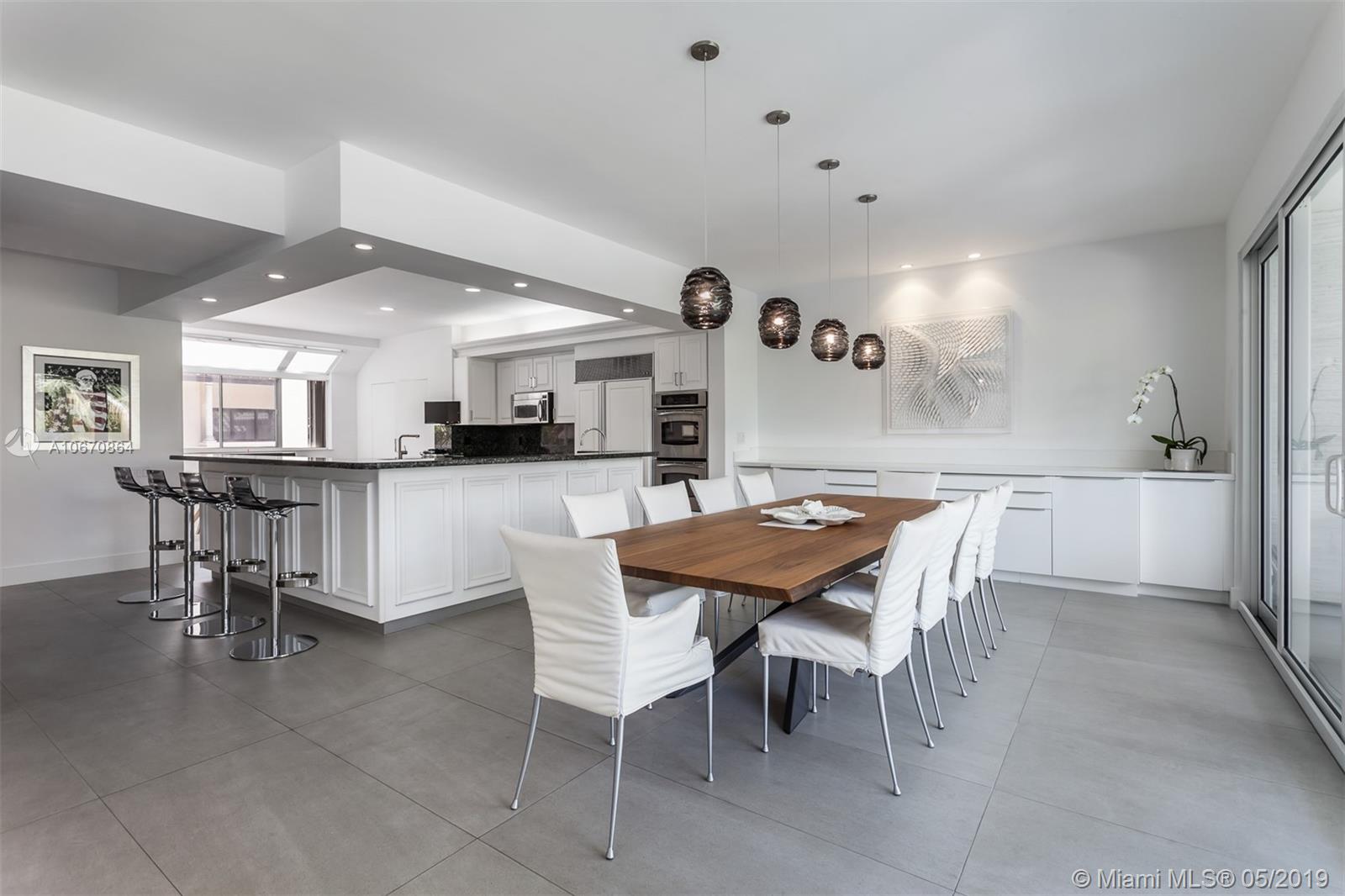 Absolutely charming tri-level residence in L&#x2019;Hermitage, a guard-gated, luxury bayfront community in Coconut Grove. Enjoy the 3,493 SF spacious floor plan with formal living, dining room and family room adorned by high-ceilings and high-end finishes. Elegance and style are also present in the eat-in kitchen that comes with granite countertops, top-of-the-line appliances and a bright oversized breakfast area. A great master bedroom features private terrace and sitting area, two walk-in closets and beautiful master bathroom with large bath tub. L&#x2019;Hermitage features a community pool, boat slips and tennis court and is located minutes away from fine dining and shops in the Coconut Grove area.