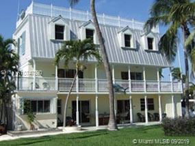 Formerly a licensed 4 unit  Bed and Breakfast with 10 Boat slips. New roof, Water front property on Largo Sound. 
 Property in need of repair after Hurricane Irma.  A real gem in paradise drive one hour from Miami to Key largo and feel you left the country.  Owner financing available.