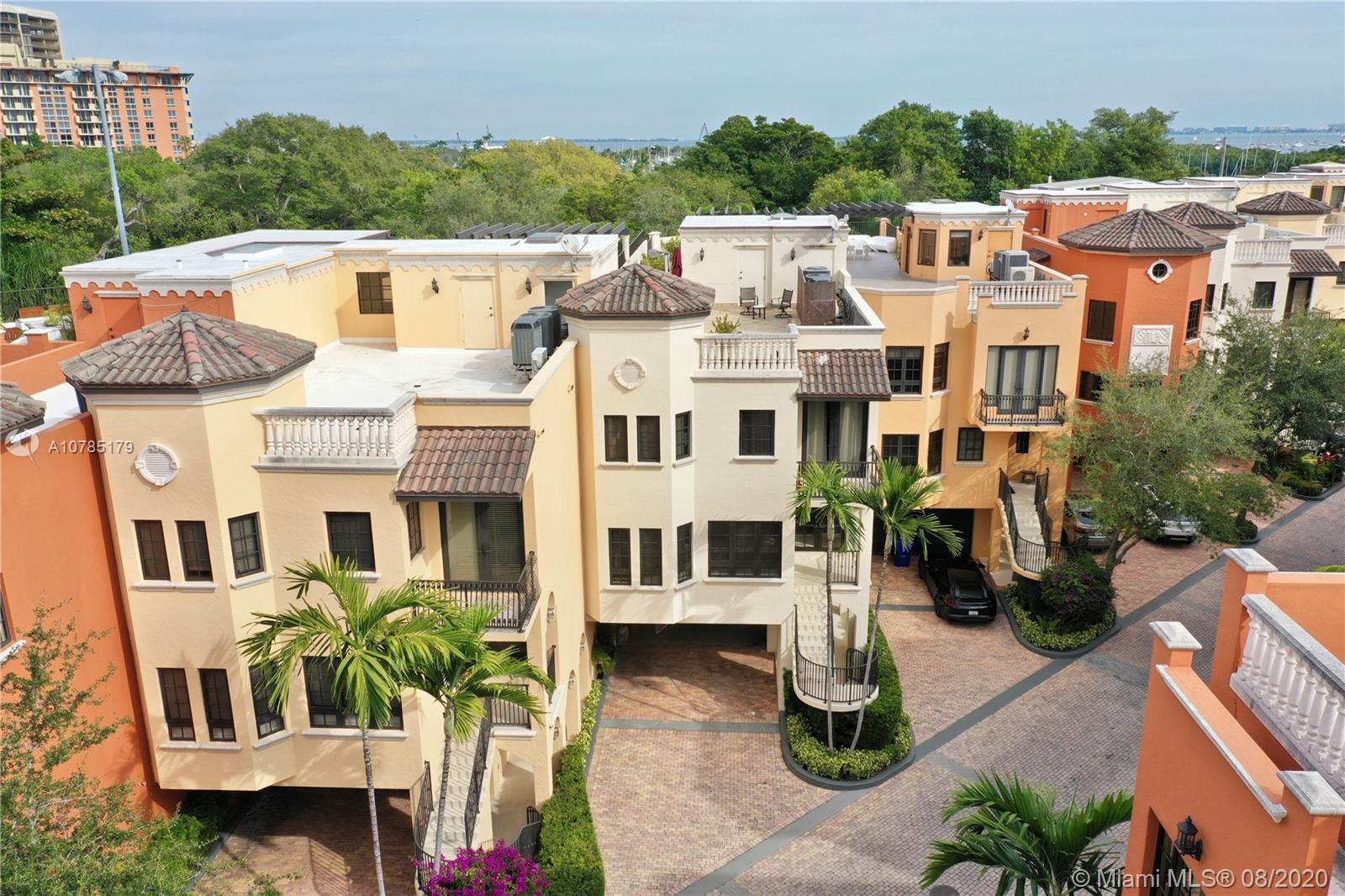 Rare opportunity in Cloisters on the Bay located in the heart of Coconut Grove and within walking distance to local stores, restaurants, and private schools. This oversized  5,650 sq ft unit is move in ready offering 4 bedrooms with en-suite bathrooms, living room, family room, as well as a full den, home office, wet-bar, laundry / utility room, and built closets. This home has 2 entrances, a private elevator, 4-car driveway and 2-car garage equipped with 220 power for electric vehicles. There is also plenty of room for storage throughout. The unit also features an expansive outdoor rooftop area that includes a hot tub and lots of space for outdoor dining and relaxing. The neighborhood itself features a clay tennis court, heated swimming pool, clubhouse, and 24 hour security. Easy to Show!
