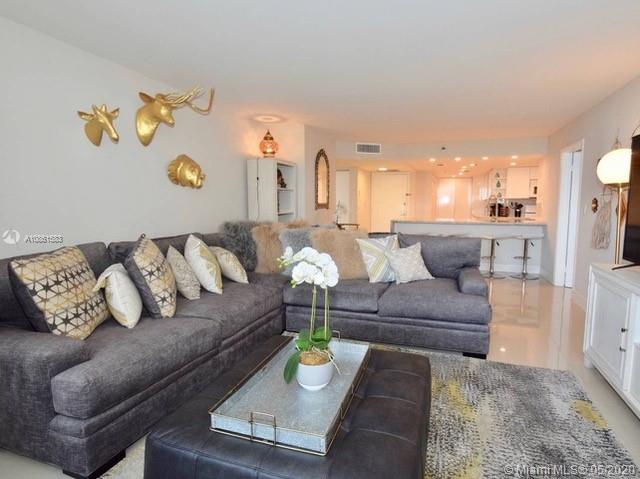 Will rent unfurnished. This exquisitely, totally remodeled 3/2 features: a large open kitchen with cascade granite kitchen counter perfect for entertaining, full length balcony with spectacular views of Biscayne Bay from every room, gorgeous 48"X 48" porcelain floors throughout, spacious split floor plan layout, very large master bedroom with huge walk-in closet, marble bathrooms with jetted tub in the master bathroom. Washer dryer in unit! This amazing unit is completely remodeled, move-in ready, and priced to sell...it won't last! The Grand is a full service condominium with a variety of amenities all conveniently located in the building including restaurants, food market, marina, shops, 24 hour Concierge, security and much more. Impact windows throughout.