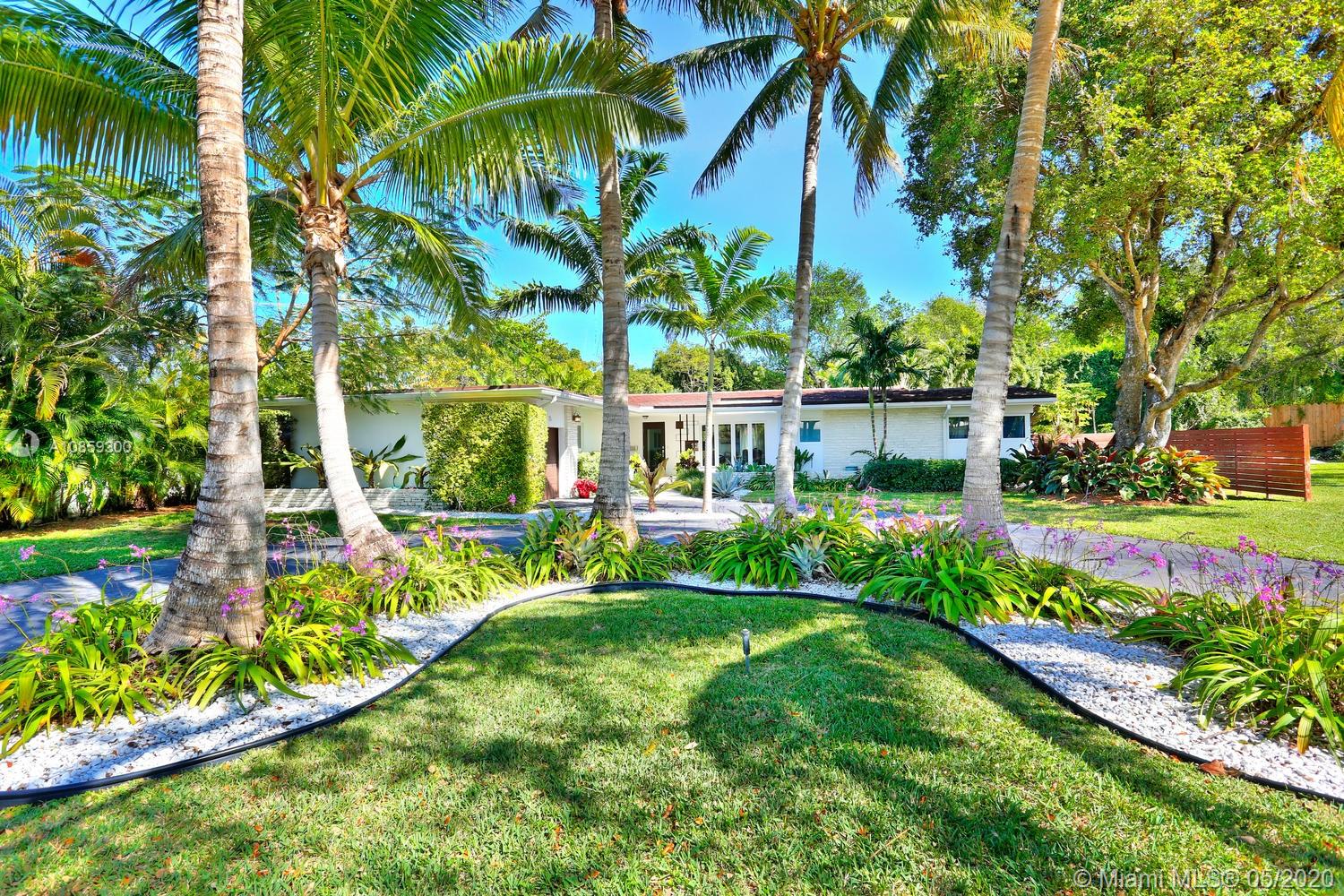 Stunning home, surrounded by close to a half-acre of lush tropical gardens in prestigious North Coconut Grove. Light-filled formal living, dining & family rooms w/walls of glass overlooking the ultra-private, resort-style pool & terrace. Major renovation in 2015, including porcelain tile & wood flooring, custom built-ins & impact glass throughout. A spectacular open kitchen features sleek euro-style wood cabinetry, stone countertops, gas range, high-end appliances, island w/seating + breakfast area. 4BR/4BA + housekeeper&#x2019;s room. Expansive master suite includes his & hers custom walk-in closets & spa-like bath w/soaking tub & frameless glass shower. 24/7 security patrol. 16&#x2019; above sea-level. Close to the Grove village&#x2019;s bayfront parks & marinas and minutes to downtown, MIA & the Beaches.