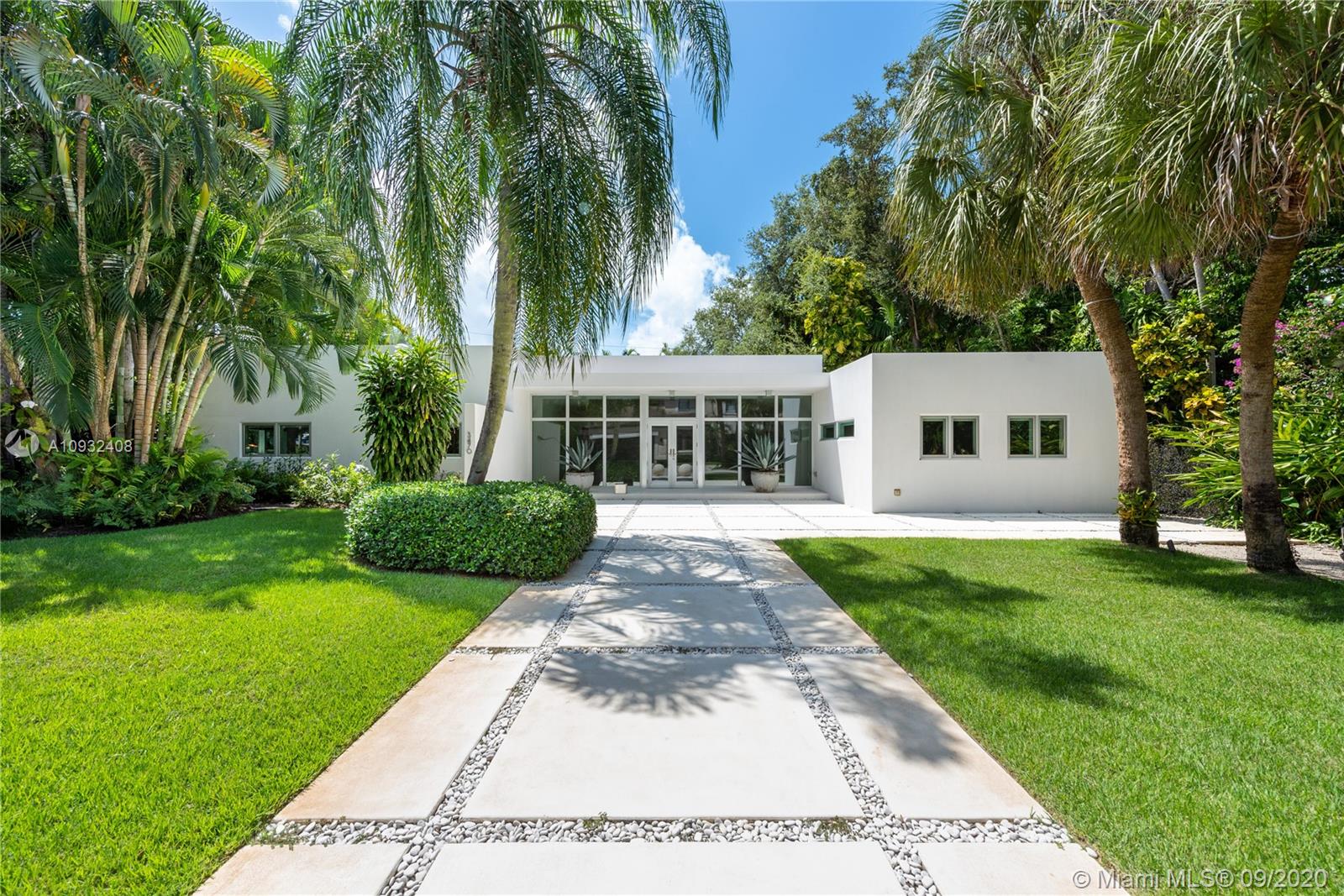 Contemporary Miami modern home is the ideal combination of modern architecture simplicity and an indoor/outdoor lifestyle. An open concept of sophisticated living space offers an abundance of natural light and sublime pool views. A glass backsplash with customized stainless steel cabinetry and a large waterfall countertop sets a sleek tone in the kitchen. This home features 4 bedrooms, 4.5 baths, high impact Clerestory windows, and polished concrete floors throughout. Nestled in the coveted 24/hour guard-gated enclave of "The Moorings" a bayfront community with a private marina, 3 parks, and direct ocean access. Walk or bike to Downtown Grove Restaurants, shops, and some of the best private schools.