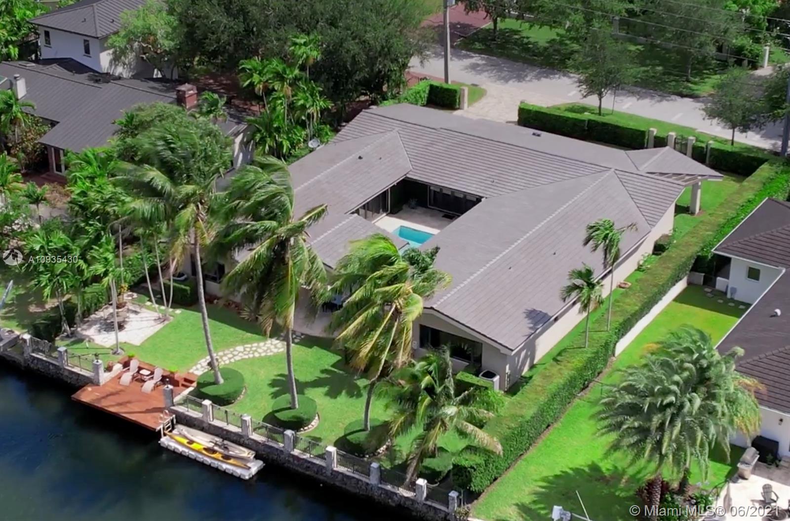 This gorgeous home is on the Coral Gables Waterway with its own dock and is just a 15-minute boat ride to beautiful Biscayne Bay. This gated property is close to shops of Merrick Park, less than 3 miles from exclusive shopping, international cuisine and entertainment of Miracle Mile. Close to both family-friendly Riviera Country Club and prestigious Biltmore Hotel golf course. Providing amenities such as gym, summer camp for kids, pool and many more! Outside, find plenty of entertainment space on the sun-soaked terrace just waiting to host friends and family in the sparkling pool and spa or while unwinding from a long day enjoying a meal under the covered patio.