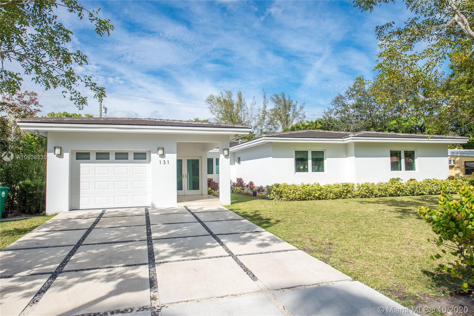 Exquisite designed with the finest finishes, this home features an amazing layout, natural bright light throughout the house, open & spacious living areas, large laundry room, lots of storage space and impact windows and doors.  All bedrooms with en-suite bathrooms and serene views of the pool and/or garden.  Large master suite features a spa-like bathroom & walk-in closet.  An easy flow of indoor-outdoor spaces, covered pool-site terrace and spacious & private backyard make this a great home for entertainment. Minutes from Brickell, Downtown Miami, Key Biscayne, Coral Gables and quick/easy access to I-95.  Completely rebuilt in 2017.  10,000+ Sf lot.