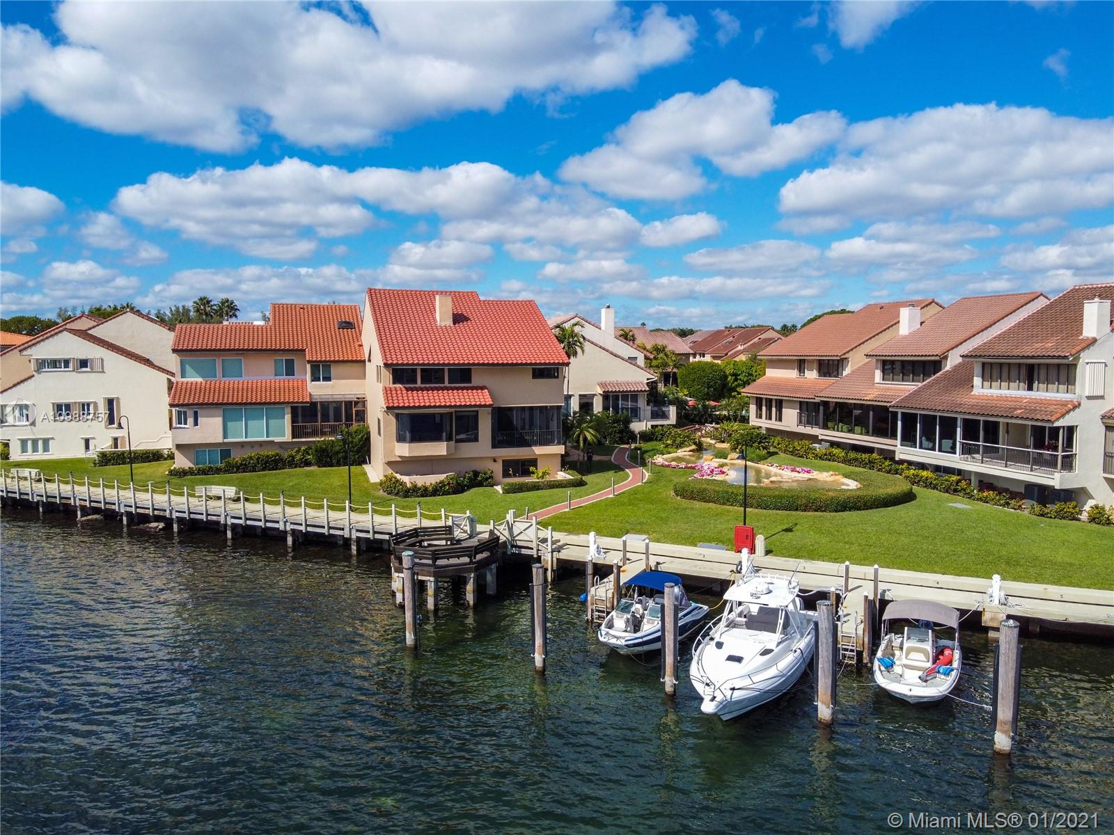 Get ready to be amazed by this beautiful waterfront townhome, with a dock, in the one-and-only gated community of L’Hermitage in Coconut Grove. Enjoy the expansive water views of Biscayne Bay and the Atlantic Ocean while sitting on your terrace or by gazing through the large bay windows inside the comfort of your own living room. This 4BR/4.5BA villa has been completely renovated inside and out, and includes full impact doors & windows, along with a 2018 roof. Wolf & Sub-Zero appliances in the kitchen. Coffered ceilings with custom shelves and cabinets in the living room. Bar w/ wine cooler & ice maker compliments the large living area with the Hemingway den. Elevator w/ modernized cab and equipment. 2 private outdoor lounge areas. Garage plus carport. Includes exclusive use of boat slip.