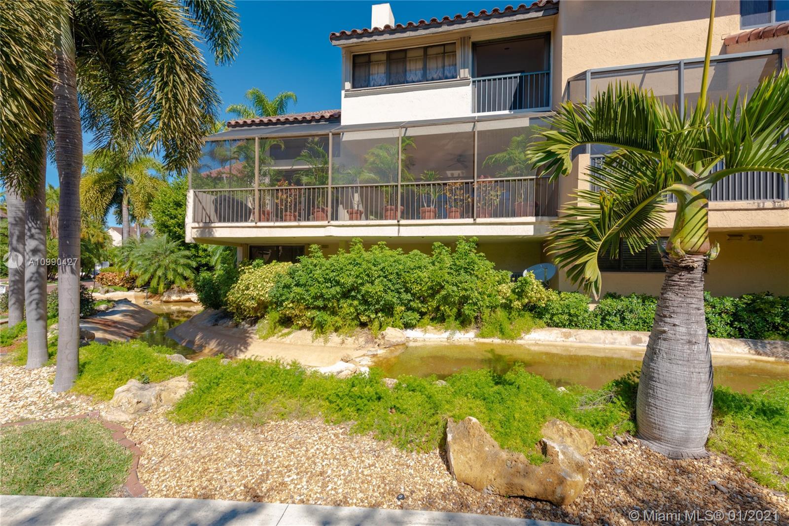 Beautiful residence in prestigious guard gated l’Hermitage right on Biscayne Bay.  This Villa has a fabulous location within the community and an extra large terrace for outdoor seating and dining with beautiful views of the gardens and pool.  This home benefits from a great layout with a large master bedroom on the top floor with its own private terrace plus a separate den/office area and another en-suite bedroom.  Enjoy the serene, safe and peaceful environment with 10.7 acres of land!  Plenty of parking at your villa, two clay tennis courts, Kayak/boating on the Bay and overall a great community!