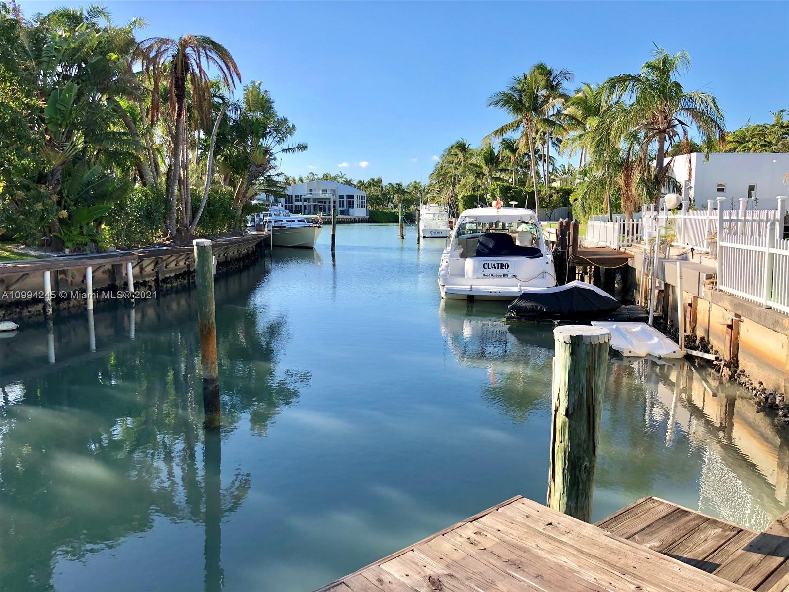 This home is located in a uniquely private corner lot at Island Drive and Cape Florida with 19,042 SF as per survey and over 25,000 SF of enjoyment, with a water frontage of 77 feet to accommodate comfortably a large boat. 
Boaters paradise with absolute privacy. This home features marble floors throughout, remodeled kitchen and plenty of space with over 5100 SF under A/C, 5 Beds, 5 Baths.  See SURVEY attached for measurements (Second Survey available as well).