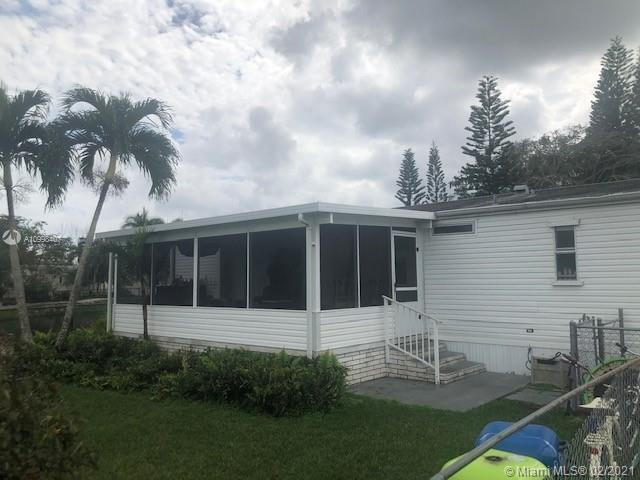 INVESTOR OPPORTUNITY! 2 BR/2 BA LAKEFRONT MOBILE HOME IN GATED COMMUNITY.  COZY HOME WITH GREAT VIEW OFFERING STAINLESS STEELE APPLIANCES, SCREENED PATIO, FENCED IN YARD, SHED FOR STORAGE, WOOD DECK, HURRICANE SHUTTERS & GATED COMMUNITY W/ POOL.  LEASED UNTIL 8/31/21