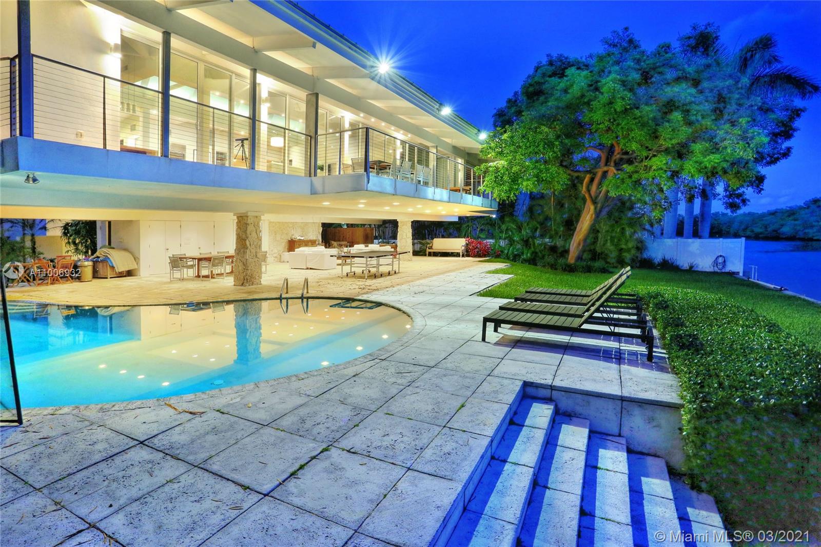 Extraordinary waterfront location. Unique contemporary architecture facing Pines Canal and State Park Bill Baggs. Direct access to Biscayne Bay. The location of this residence is a jewel. Total privacy on a double cul-de-sac street. Gated. Yacht accommodation, large covered pool area to enjoy the water view, cabana bath w/ large inviting couches. The house is elevated w/large Master Suite, reception area, office & open kitchen w/direct water and State Park view. 3 additional bedrooms on the other side of the house. Wood floors t/o the house. High ceilings. Top of the line kitchen, concrete countertop. Reception area offers loft feeling that blends with the exterior. Large balcony. Beautiful landscape and trees.