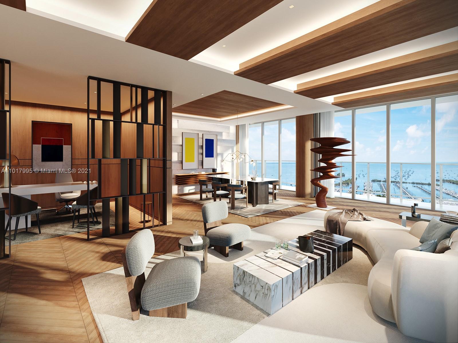 This full-floor penthouse at Grove at Grand Bay has been conceptualized by Tamara Feldman Design to instill depth and character to this architectural marvel by Bjarke Ingels which twists exotically on the Coconut Grove skyline. Spanning 10,118 square feet of interior space, the proposed design combines various natural elements such as herringbone floors and wood veneer ceilings with cove lighting in the living room and illuminated limestone in the dining room, with oversized bronze doors leading to the office. Under the 12-foot ceilings, the hurricane impact glass walls offer spectacular views of the Coconut Grove waterfront, enveloped by long, deep balconies. Meanwhile, one floor up, an exquisite private roof deck with an oversized pool is your arcadian oasis.