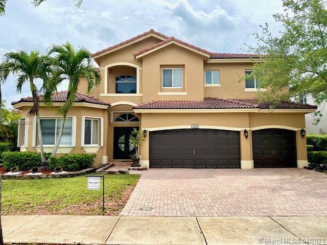 Magnificent two-story corner home located in the exclusive Palm Isle Estates. This beauty boast 6 bedrooms (2 bedrooms on the first floor) 4 bath (2 bath on first floor) and a three car garage ( two car garage has been converted into a playroom). This dream home is perfect for entertaining all of your guests! Enjoy your own private oasis under an extra large covered patio, heated private pool with a hot tub while the kids play tennis on their own sports court. Home has impact windows on the second floor and accordion shutters on first floor. HOA covers AT&T cable U-verse, high speed internet, monitored alarm and 24hr Gate and roving security. Open House Saturday, April 24 from 12pm-3pm.