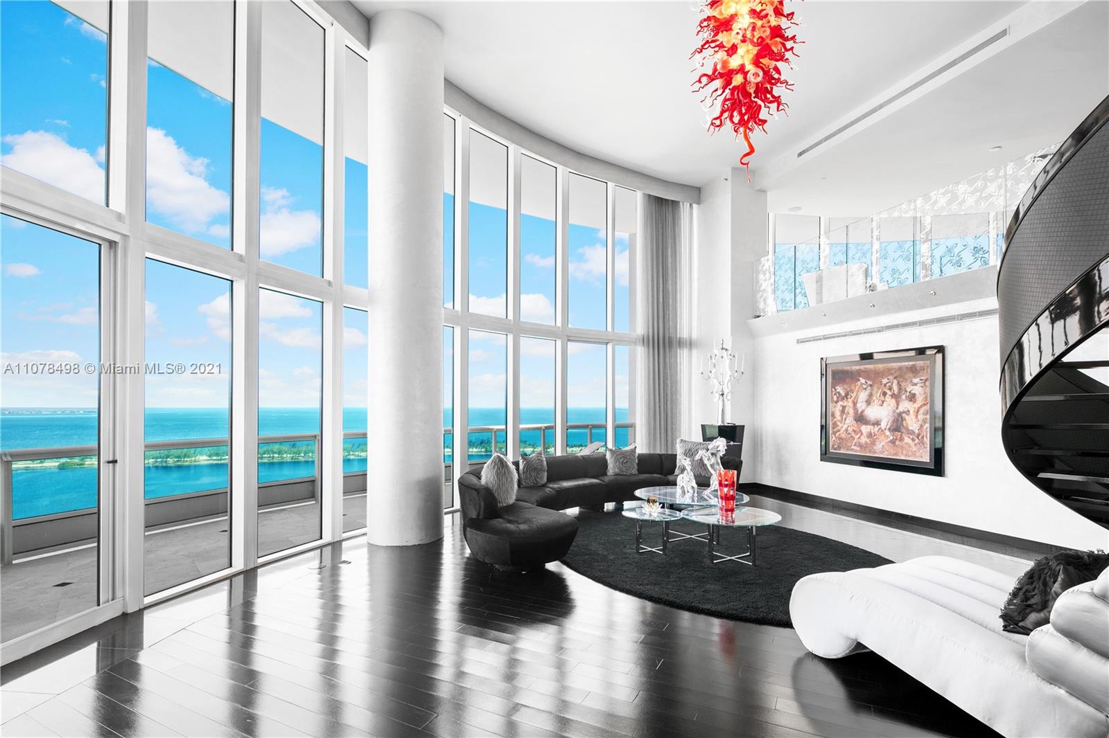 Located in one of the most sought-after addresses on the 31st floor in Brickell’s iconic Santa Maria Condominium, this one-of-a-kind 5,700+ SF two-story residence is a symbol of uncompromising elegance. Rise into the foyer of this 4-bedroom, 4.5-bathroom condo via the private elevator, and get swept away by the impressive ocean, bay and city views in each room as well as on the massive wrap-around balcony perfect for viewing sunrise or sunset. Exquisite black floors and floor-to-ceiling windows accentuate the customized living spaces and bathrooms, each with bespoke wallpaper, drapery, tiling, backsplash and cabinets offering a unique artistic flare. Price does not reflect the cost of the furniture and the fixtures. They must be purchased for an additional $150,000.00