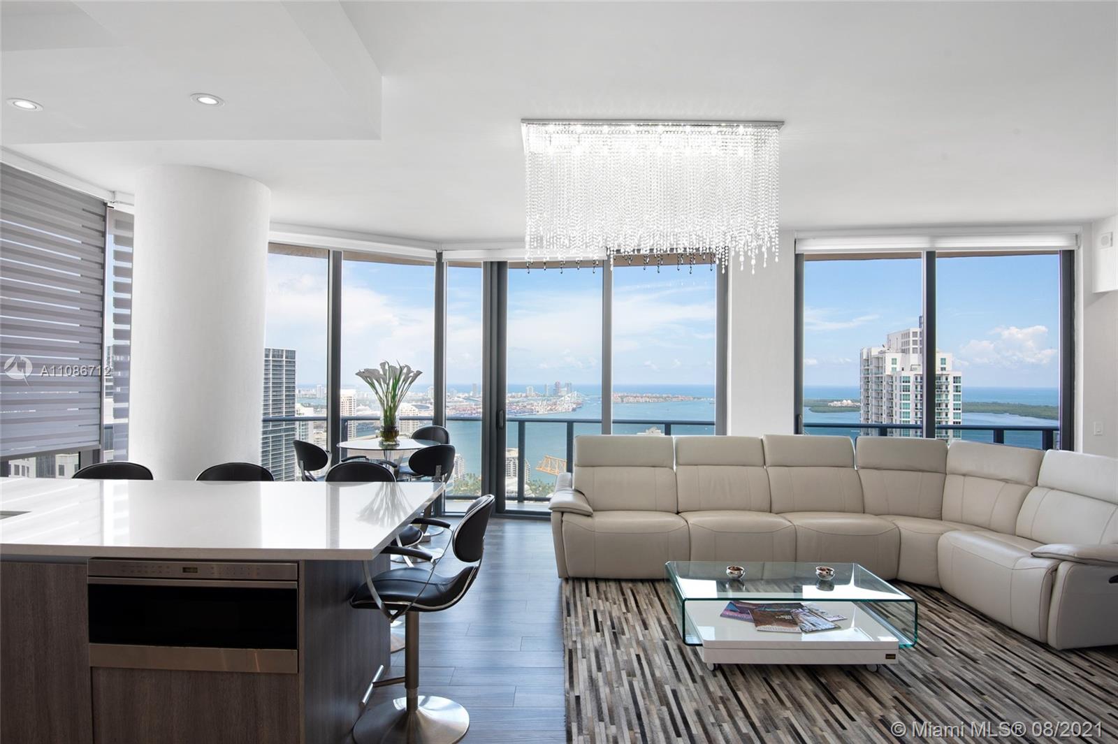 Reduced! Welcome to unit 5205 at exclusive SLS LUX.  This unit is located on one of the top floors in the building, with southeast exposure, you have the most incredible bay and city views throughout the day & night! This corner unit boasts a wrap around balcony with access from all the rooms, floor to ceiling glass windows throughout with electric blinds, 10ft ceilings, upgraded italian kitchen with oversized quartz island, top of the line appliances, private elevator & foyer. Amenities include 24/7 concierge, gym, lounge & pool decks w/ cabana and poolside bar (9th & 57th floors), Tennis & basketball court, game room, 24/7 Valet parking, basic cable & internet.