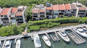 Spectacular waterfront 4 bedroom, 4 bath multi-level townhome in gated community of Royal Harbour Yacht Club. Marble floors and recessed lighting throughout. Walls of glass on every level provide serene water views. Gracious formal living and Dining rooms, Spacious kitchen with breakfast nook. Gorgeous master suite with views of Deering Bay and private balcony, walk-in closet, spacious bath. Roof top deck with wet bar and upper viewing deck, perfect for getting some sunshine or entertaining under the stars. Lots of storage areas, 1 car garage.  Amenities include access to beach and pool, tennis courts and security. All impact glass. Boat slip available separately.