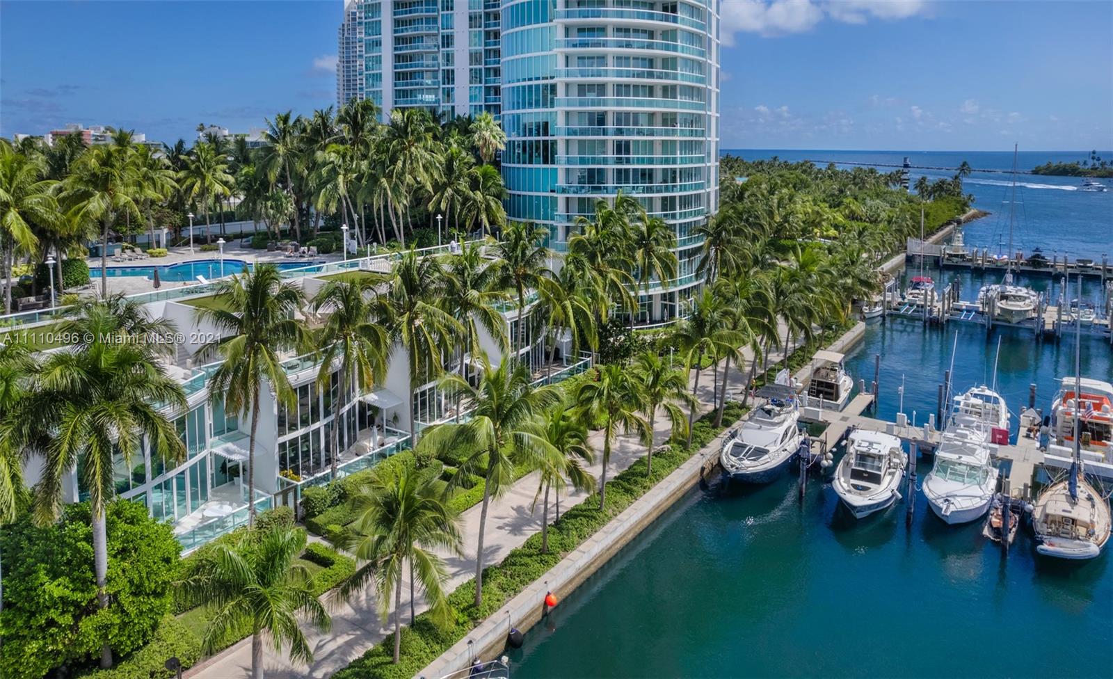 Own this unique Waterfront townhome located South of Fifth, Miami Beach's most prestigious residential address. A 3 BR/4.5 BA marina townhouse that lives like a home, with the easy maintenance & amenities of a condo. Dramatic 20-ft ceiling entry, gorgeous water views, private 2 car attached garage & tons of storage. A few steps to the Miami Beach Marina, Dock your boat right outside your front door! ENTERTAIN IN STYLE on 1,500 SF of sun-drenched & rooftop terraces. Swimmers, walk up your personal stairs to Murano’s lap pool. Dog Owners, enjoy easy access to your front yard. Take in Marina Life, Downtown Views & Stunning Sunsets. Live steps from the beach & 17-acre South Pointe Park. Walk to 15+ world-class restaurants including Carbone, Milos & Prime. This waterfront townhouse has it all!