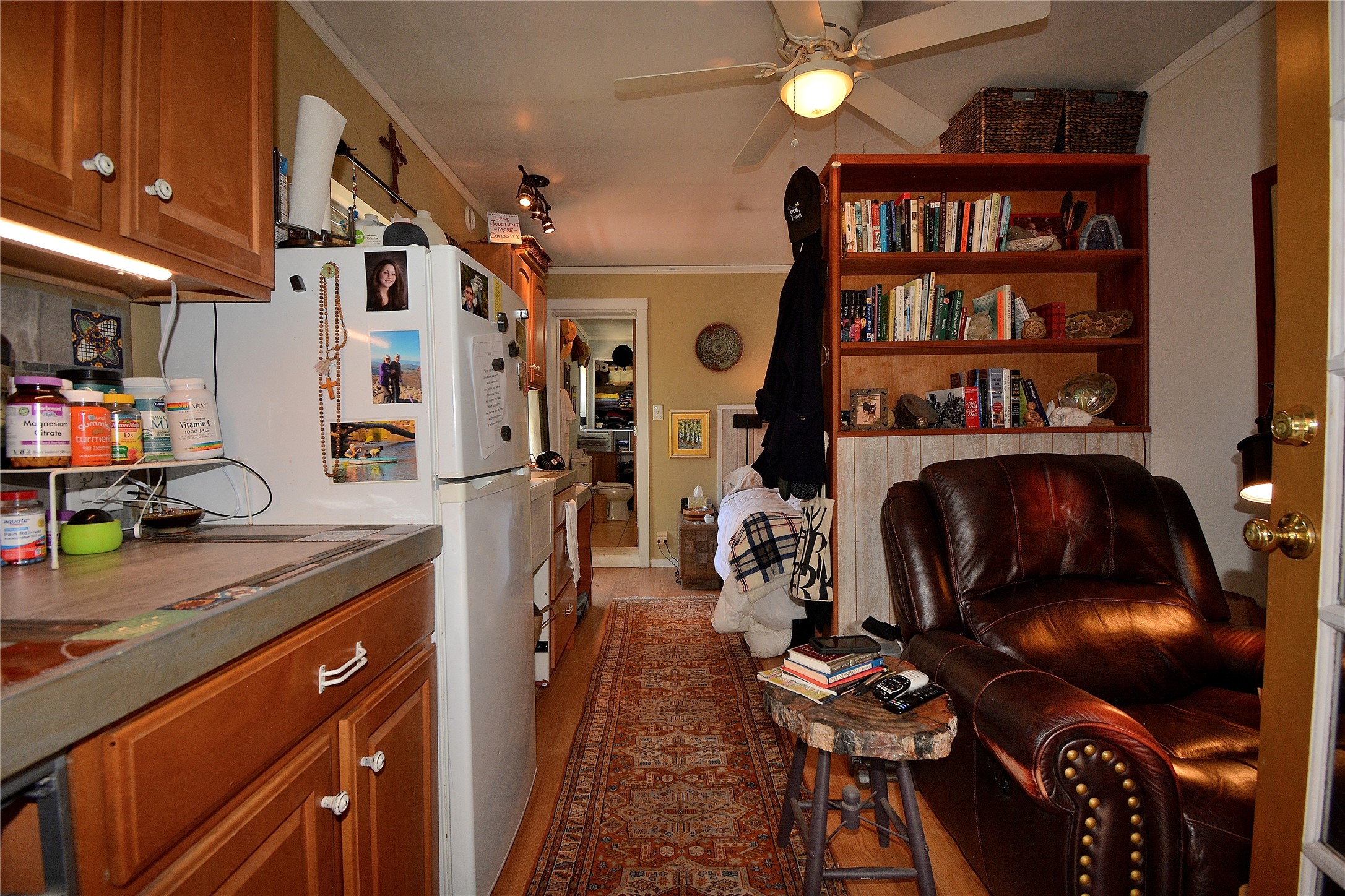 Studio apartment kitchenette and living space.
