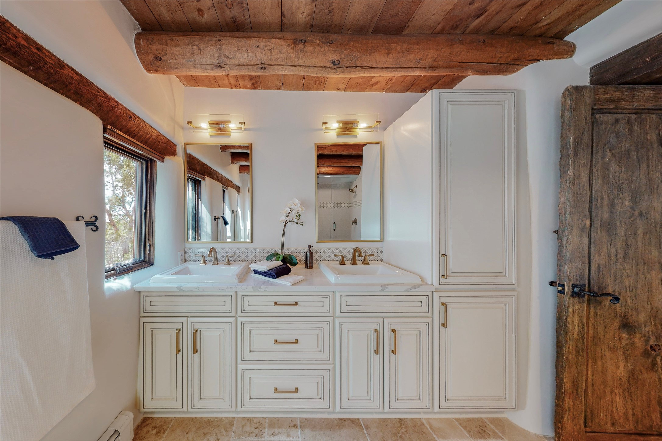 Master bath with beautiful vanity, hardware,  RH lights and mirrors.