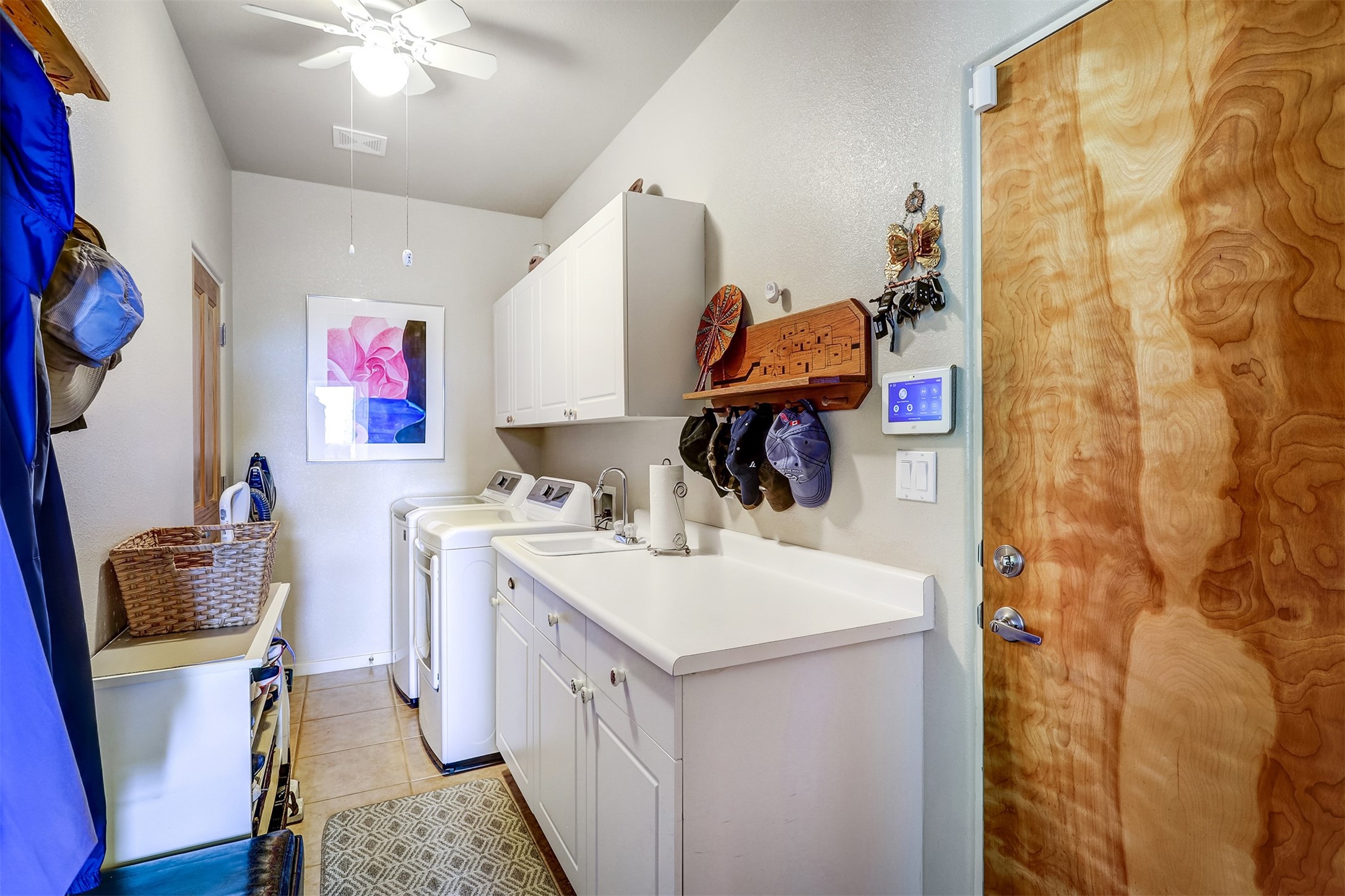 Spacious laundry Room off the two car garage