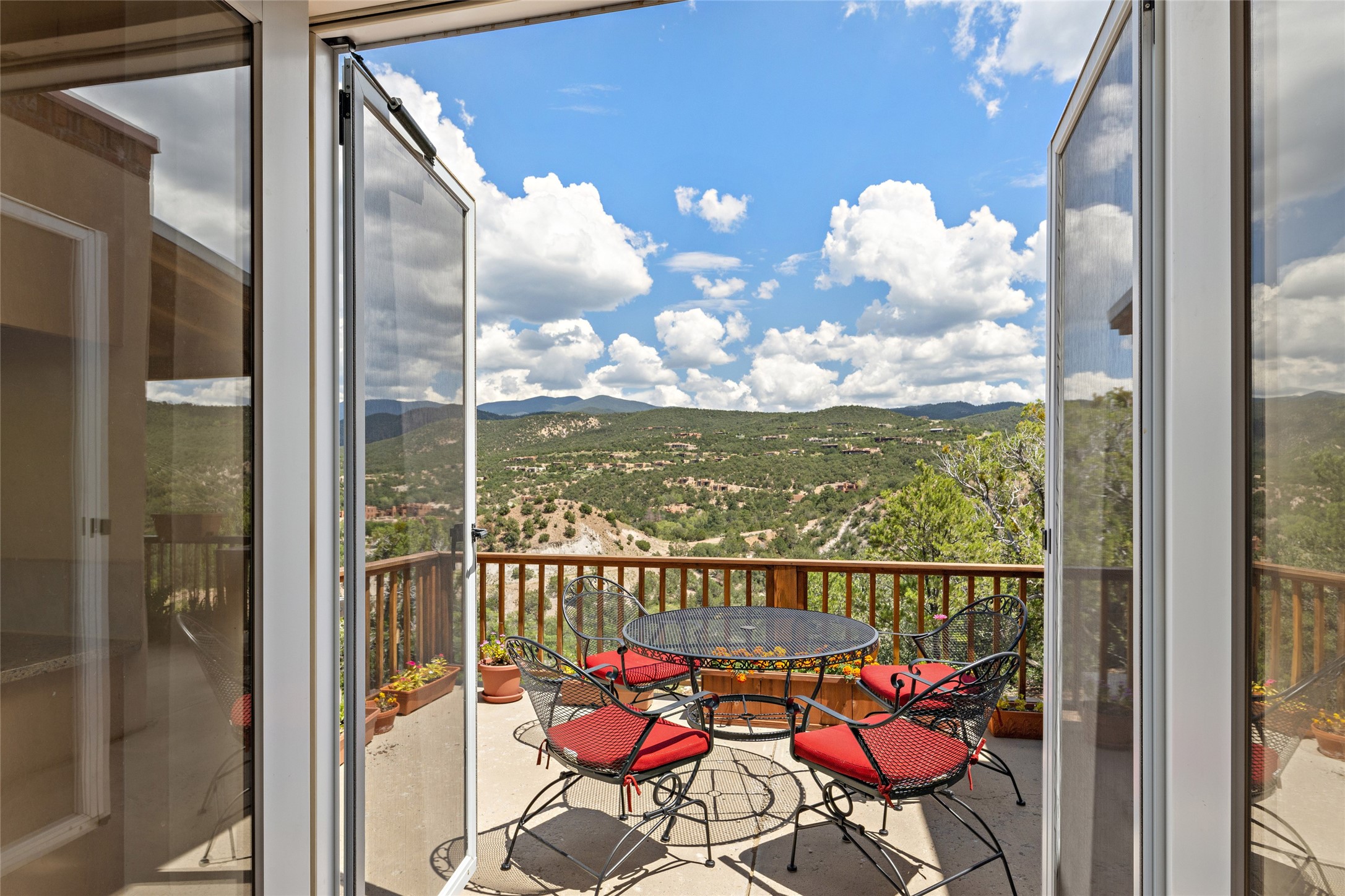 Al fresco dining deck off Kitchen with view of Tesuque and Santa Fe ski basin