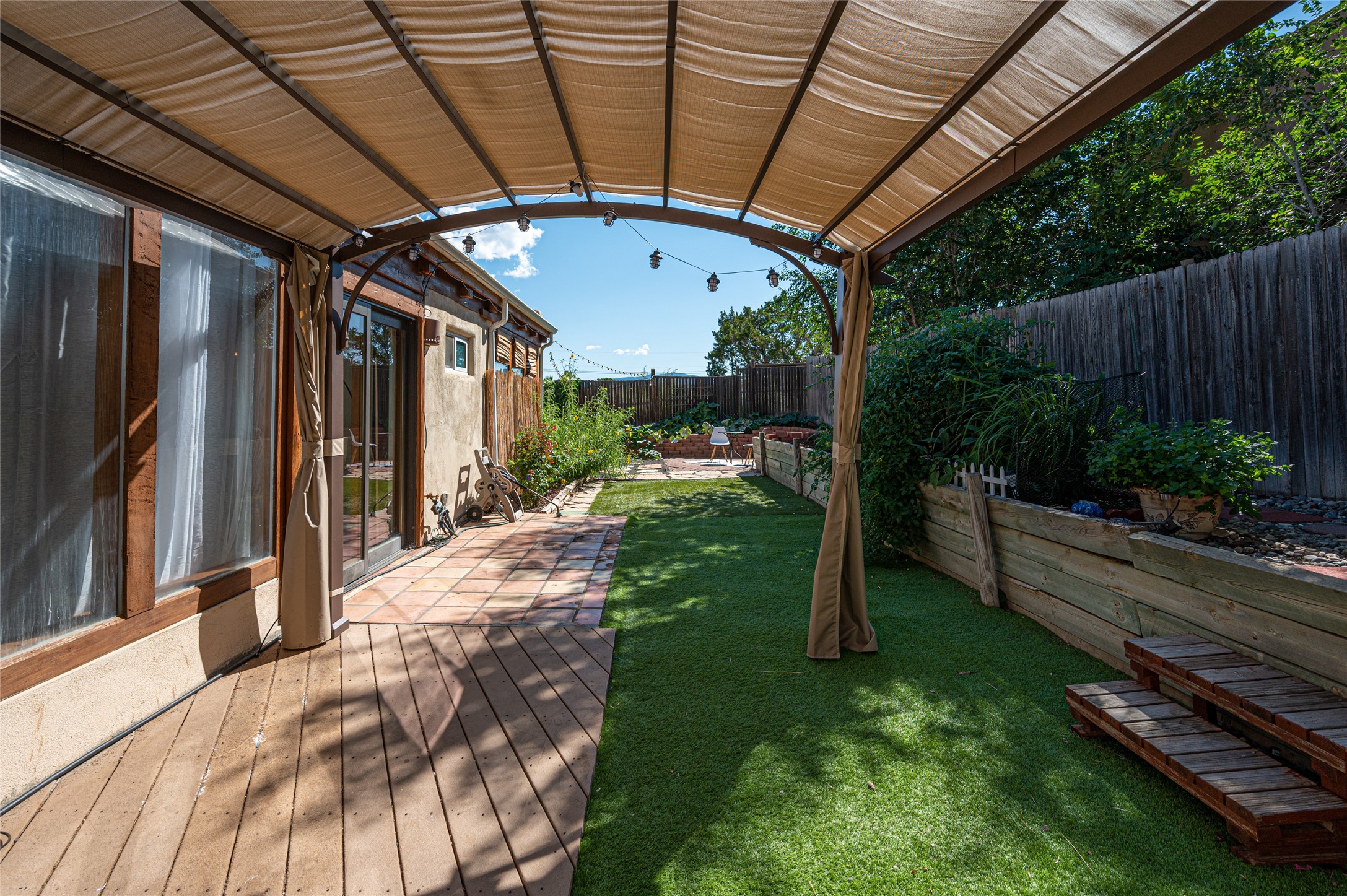 Covered Patio with Forever-green grass