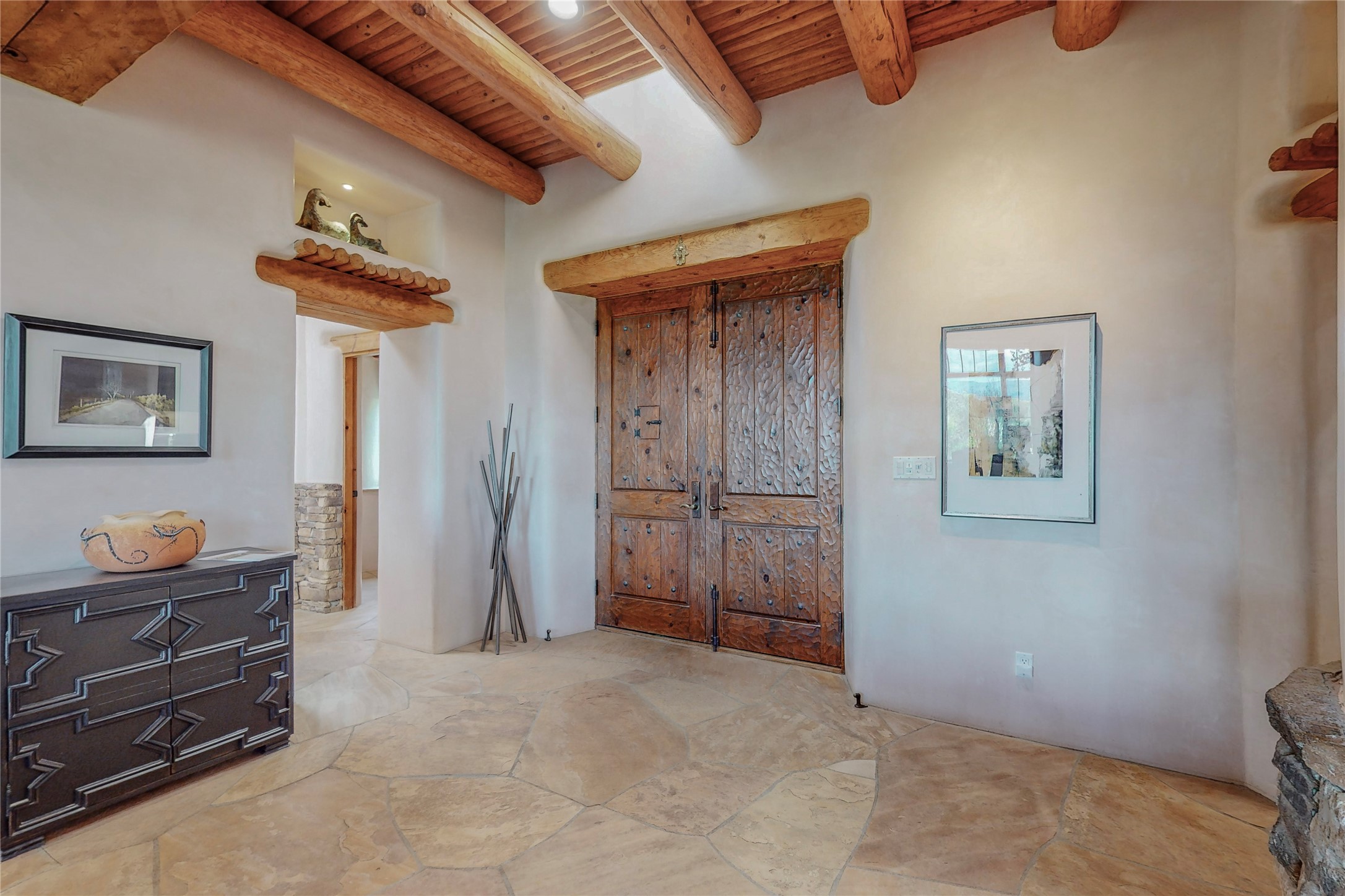 Living room upon entry with picture window that frames the view of the Sangres de Cristo mountains