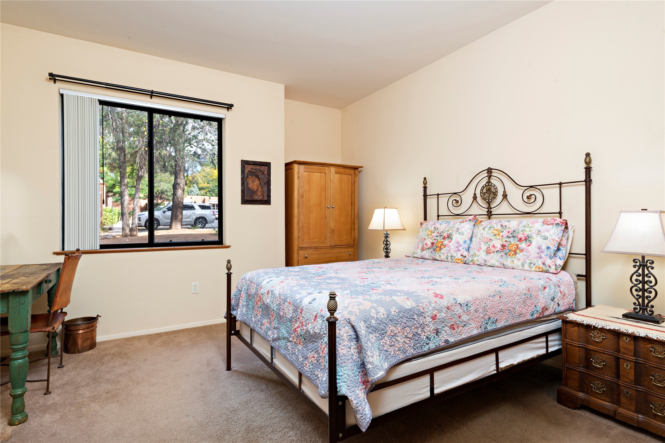 Large bedroom with ample space for a desk and other furniture.