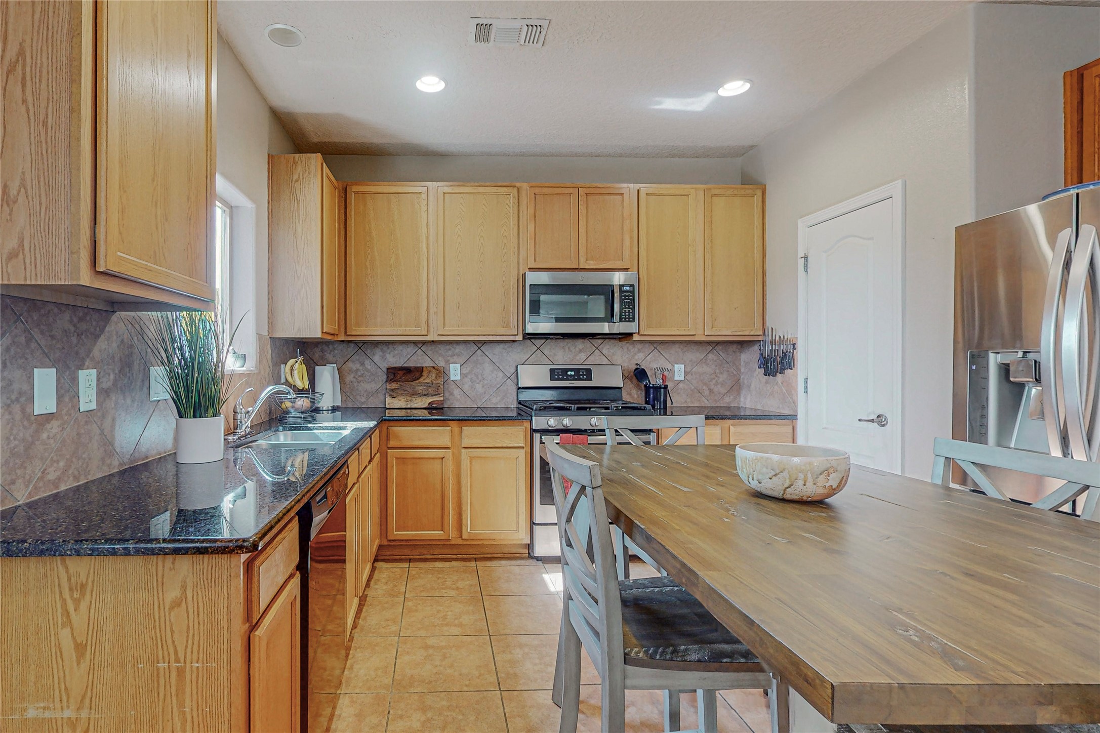 Spacious Kitchen with Gas Range and Pantry
