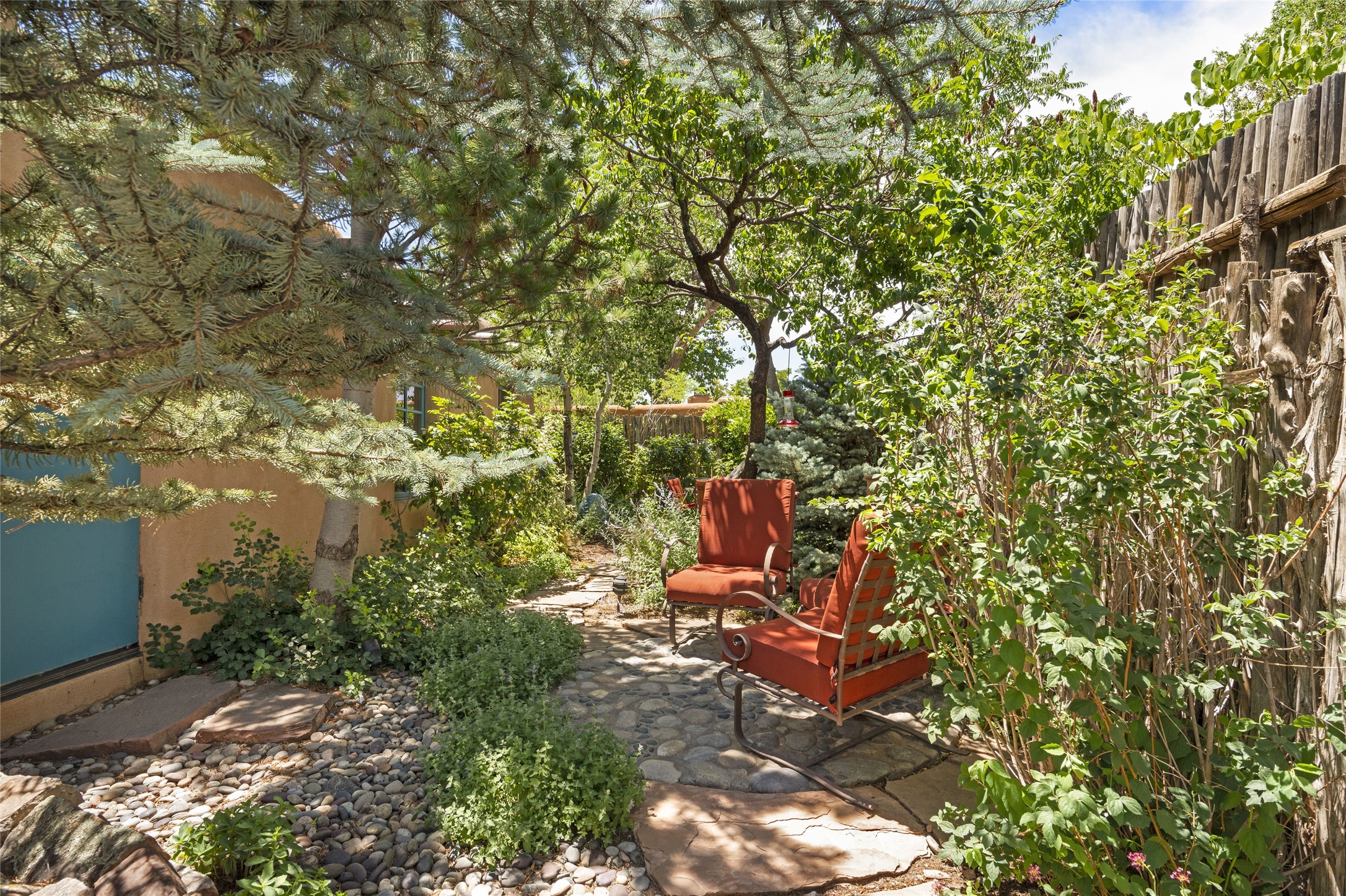 Private garden spaces surround the home.