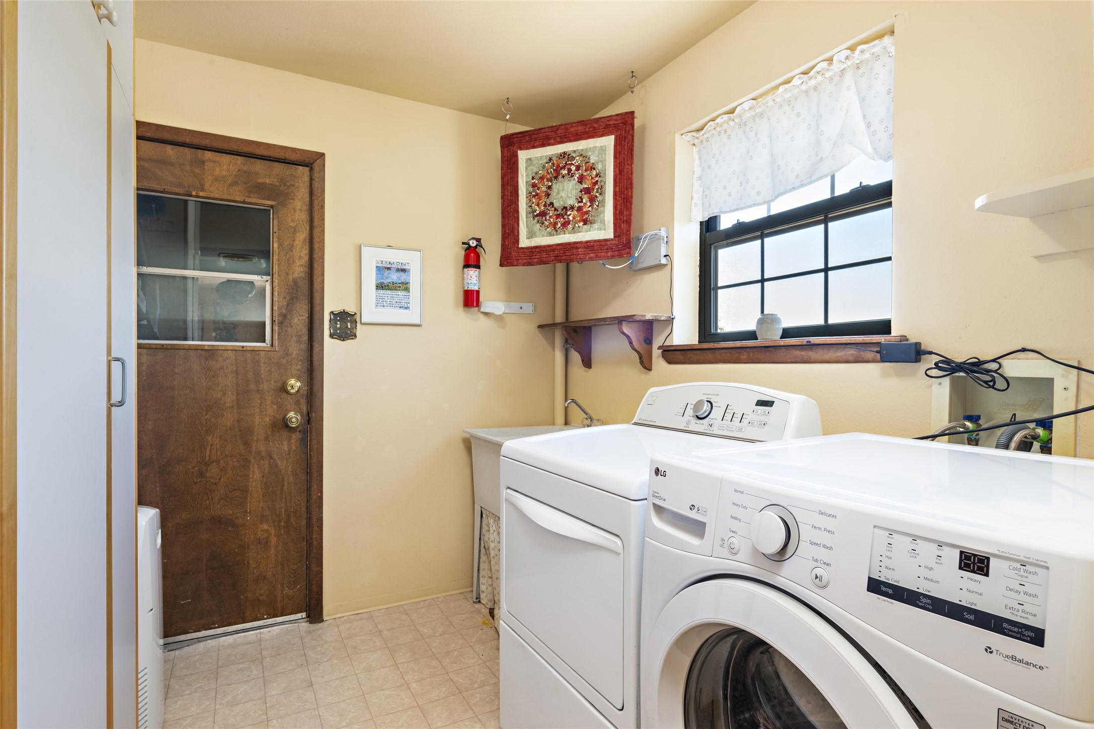 Property laundry room with storage