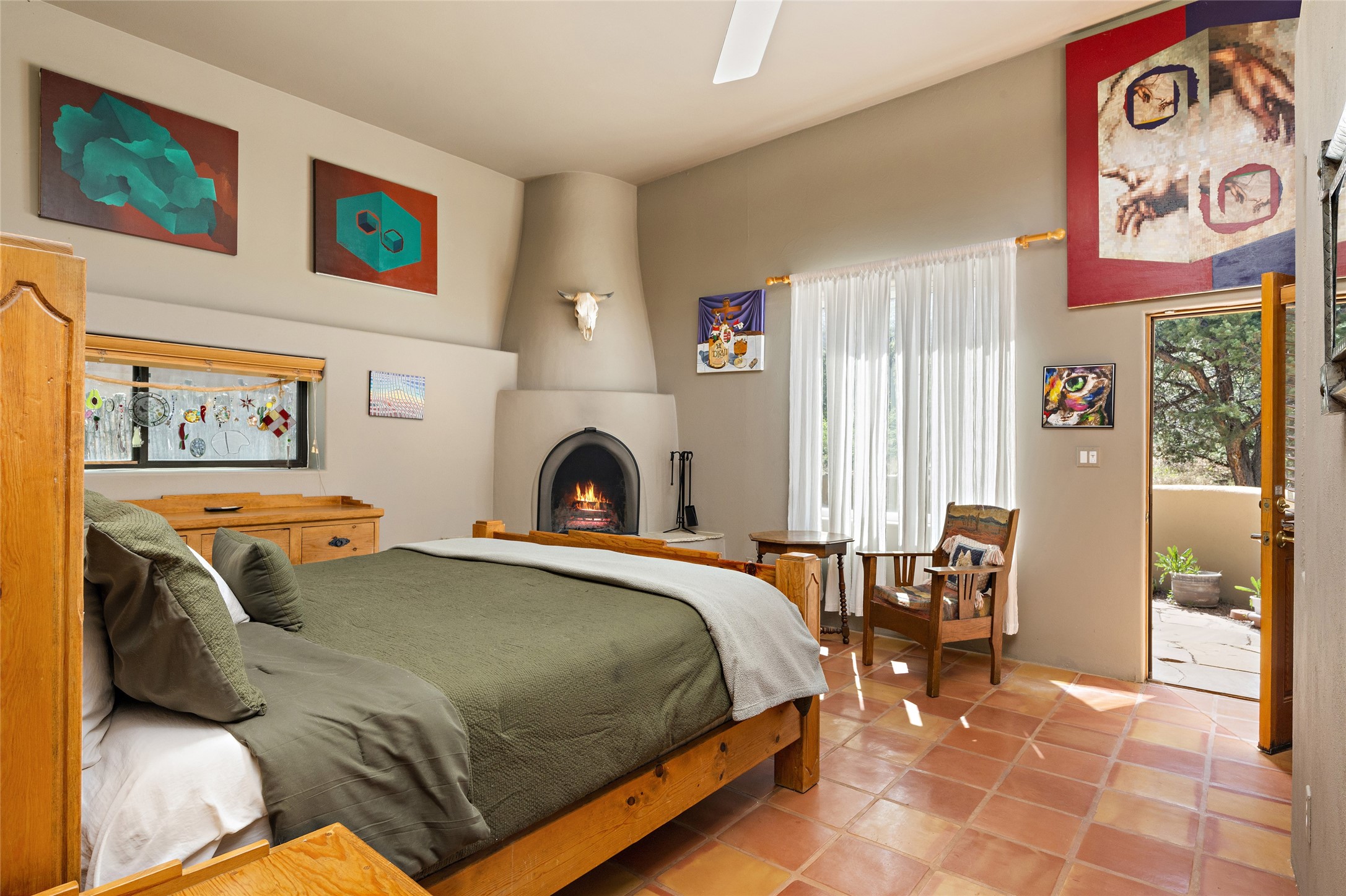 Large Primary bedroom with Kiva fireplace and opens to a gated garden