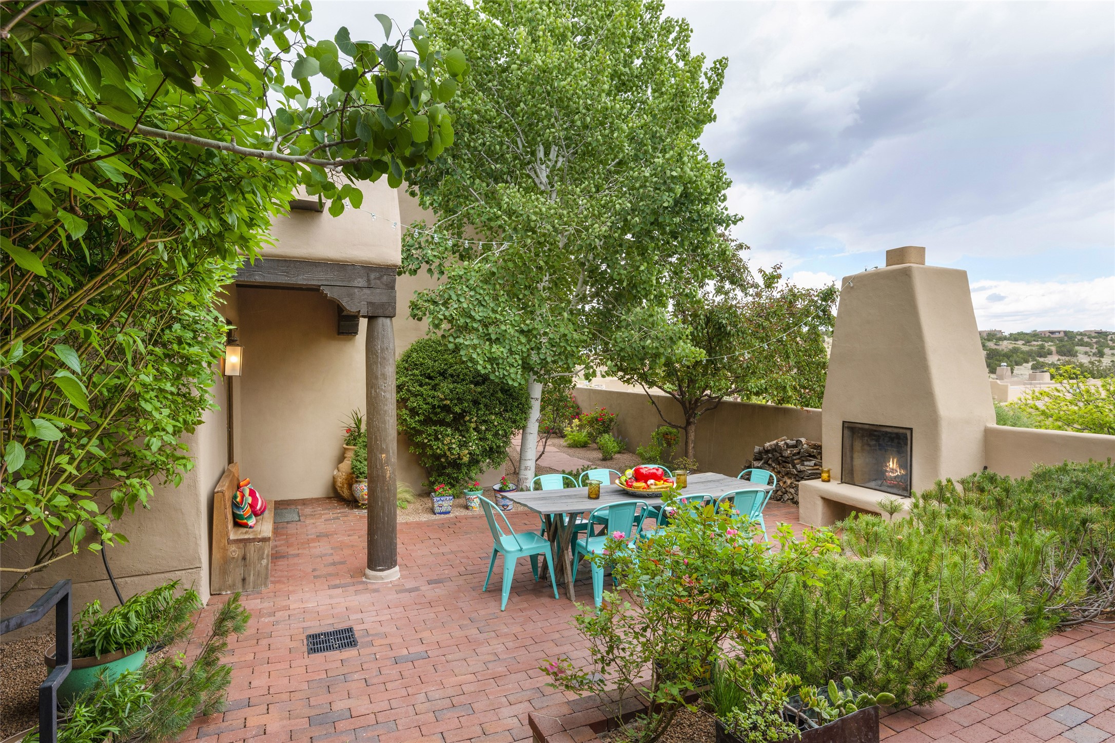 Front Courtyard w/ wood-burning Fireplace & lots of room for entertaining