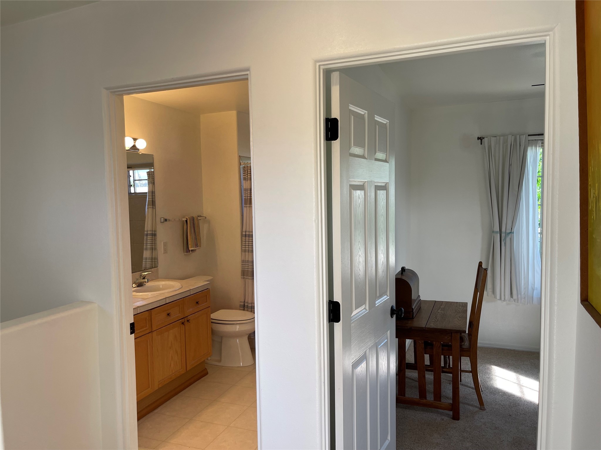 Upstairs full size bathroom, adjacent to upstairs, second and third bedrooms, or office or studio. Space