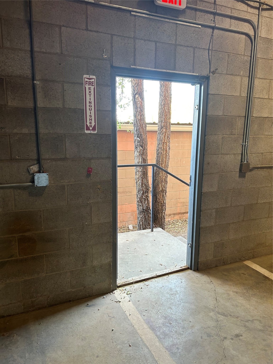 Back door opening into alley and back parking lot
