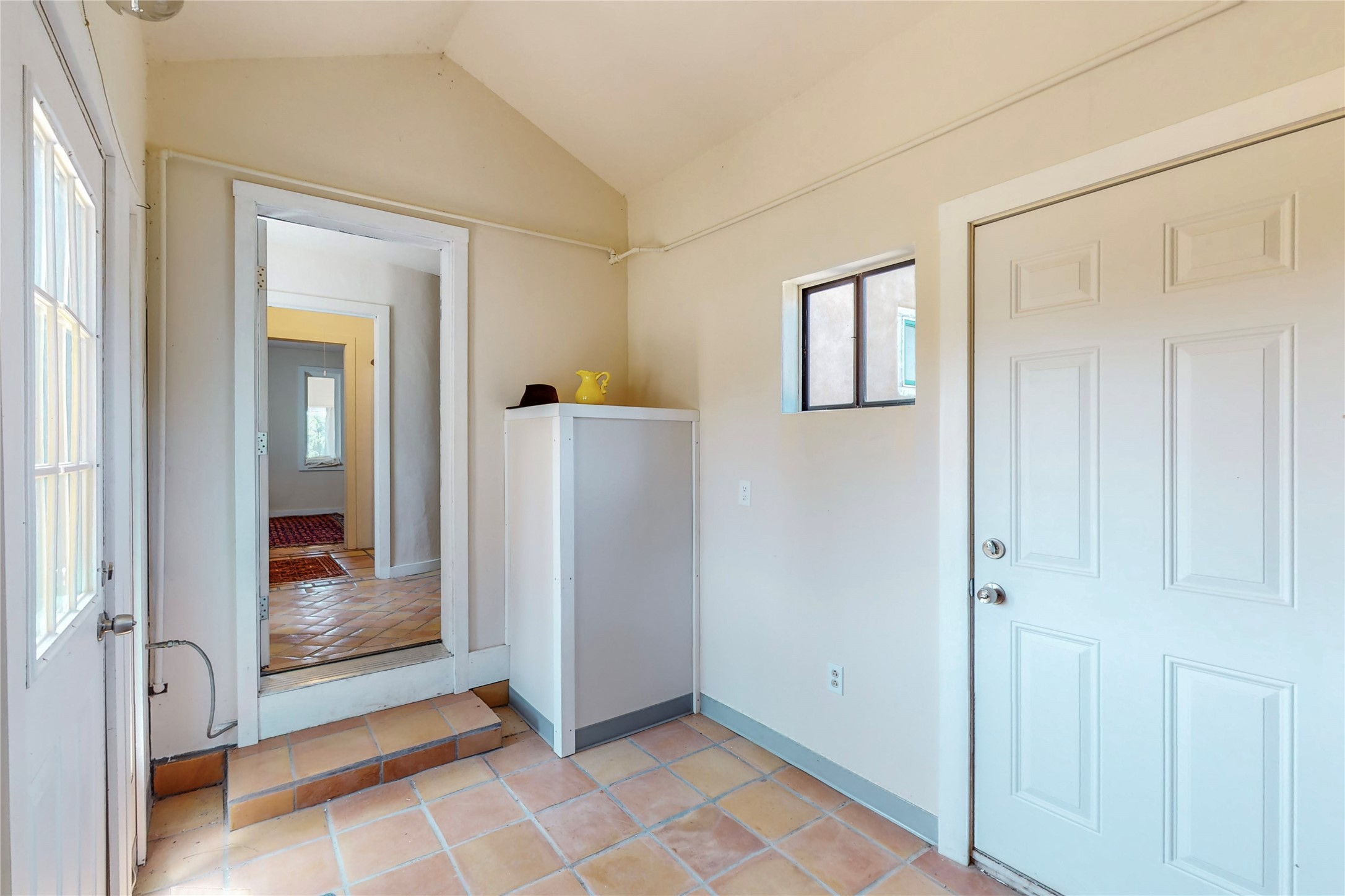 Entry, mudroom, covered hot water heater
