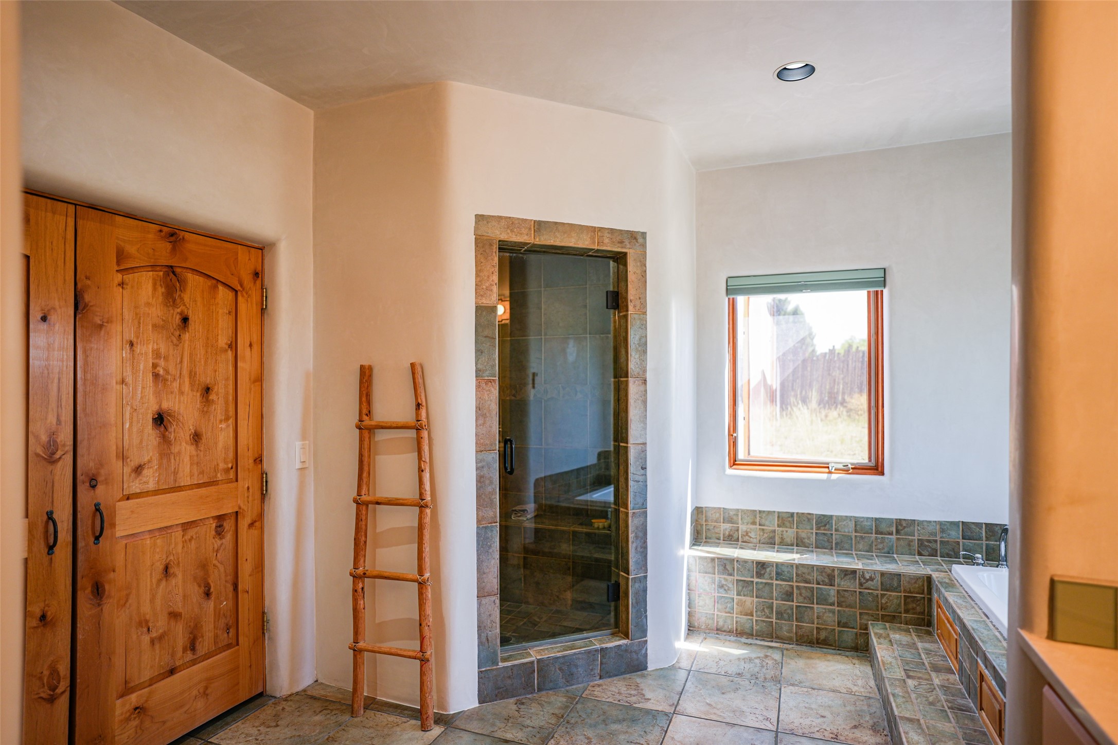 PRIMARY BATHROOM WITH ENCLOSED SHOWER AREA
