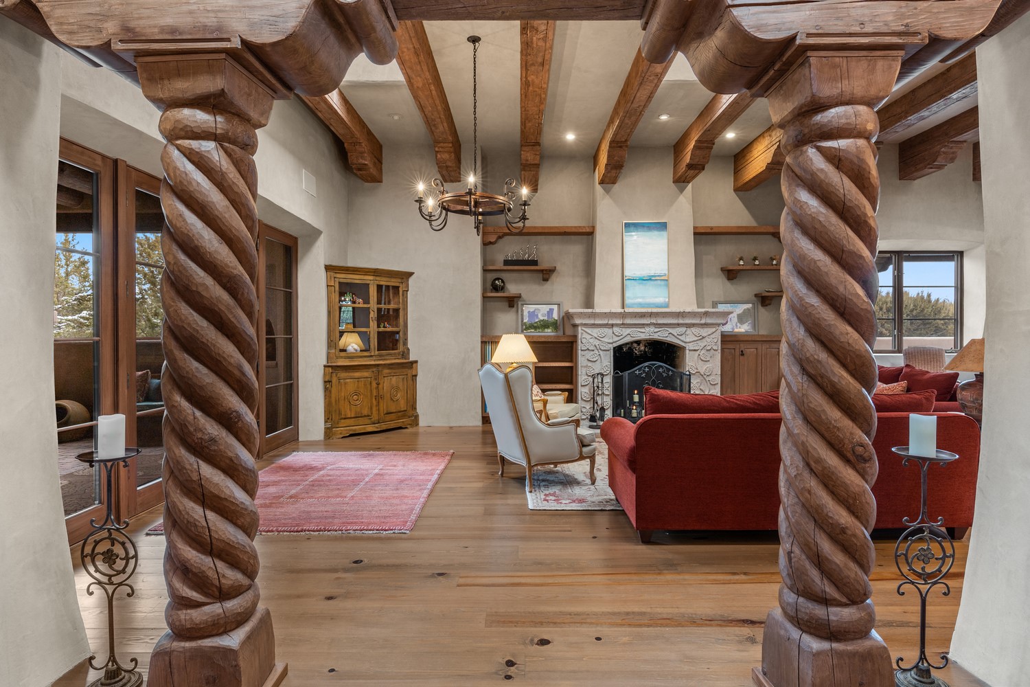 Soaring ceilings and hand-carved wooden columns greet you as you enter the home