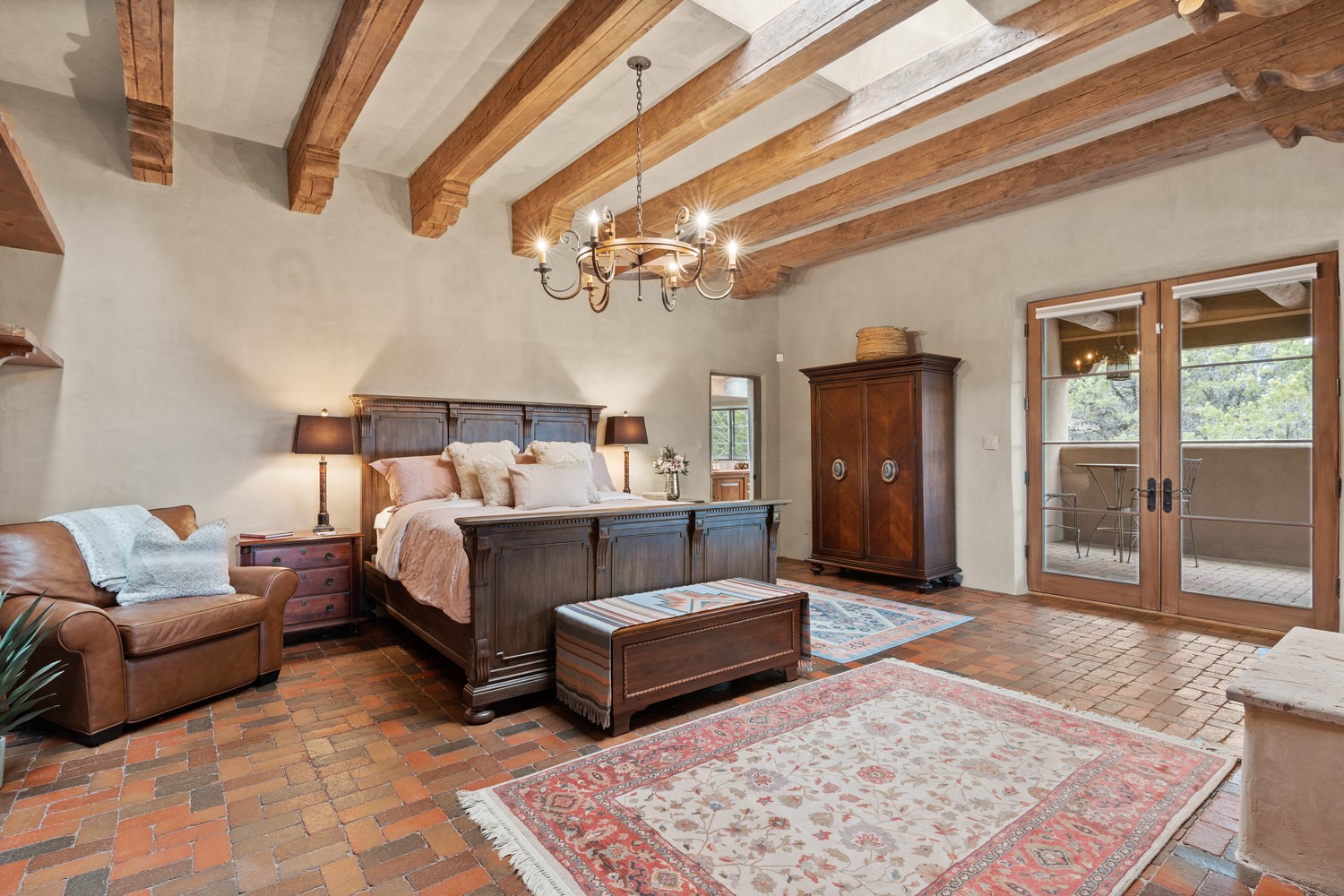 Spacious master bedroom with private patio access