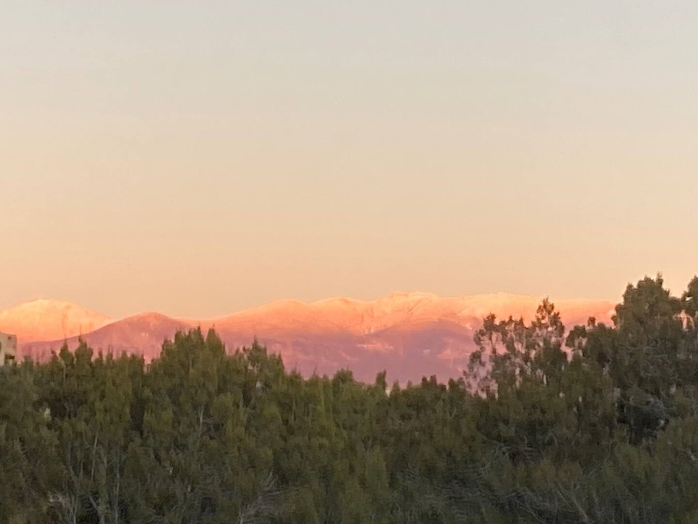 View of snow capped mountains from backyard